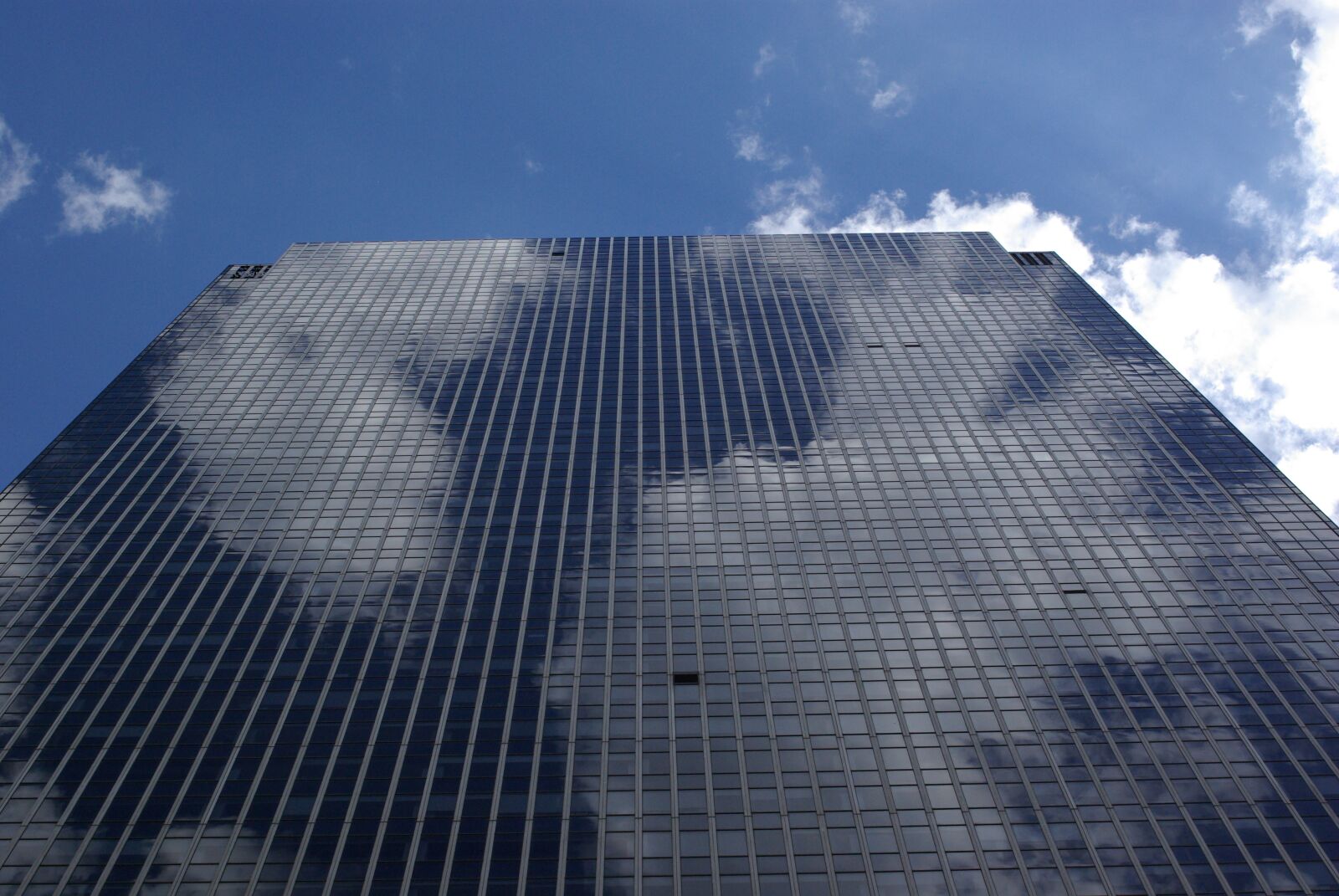 Pentax K10D sample photo. Skyscraper, clouds, city photography