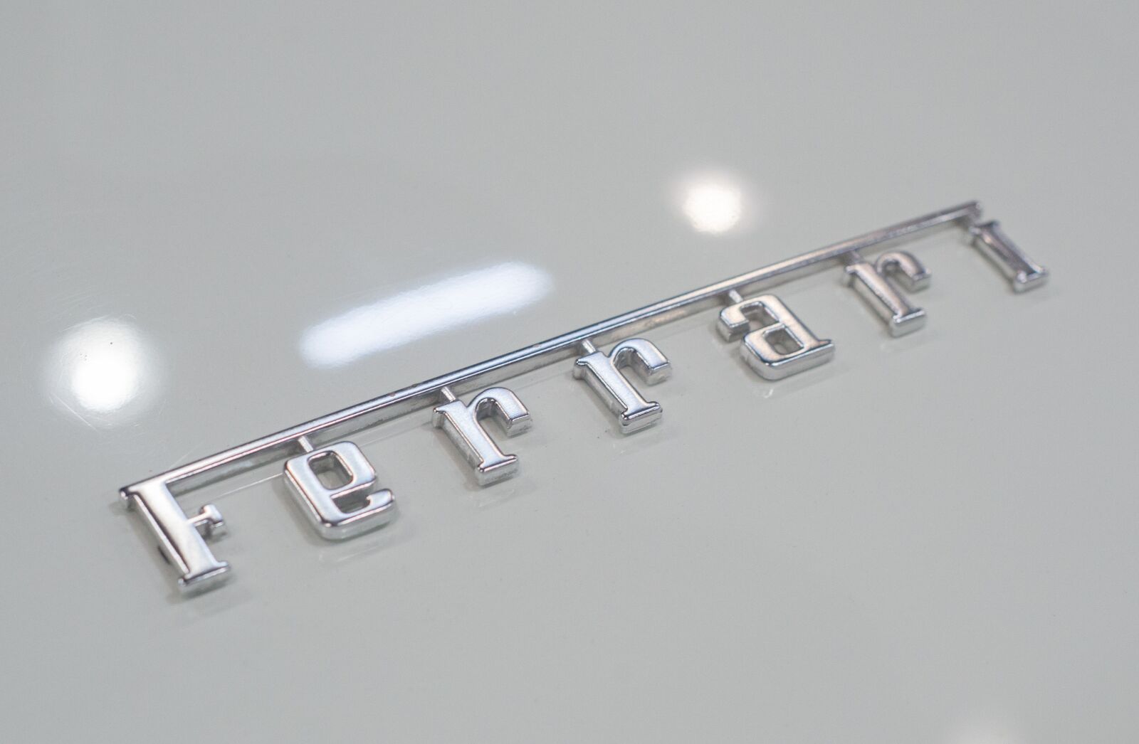 Nikon D610 sample photo. Ferrari, emblem, sportscar photography