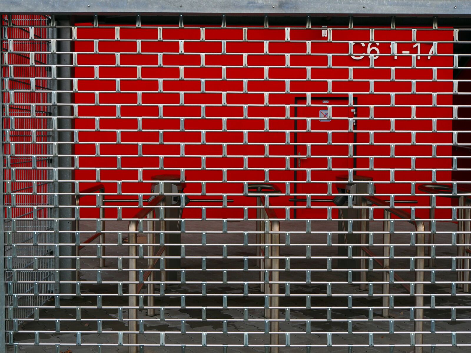 Olympus OM-D E-M10 II + LUMIX G 25/F1.7 sample photo. Roller shutter door, turnstiles photography