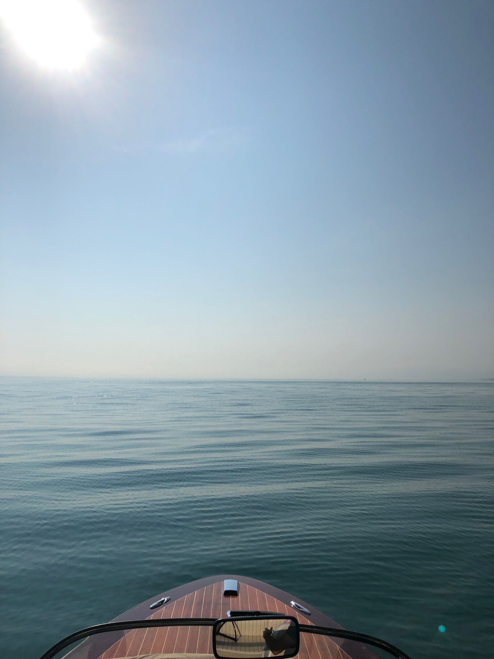 iPhone X back dual camera 4mm f/1.8 sample photo. Boat, lake constance, sky photography