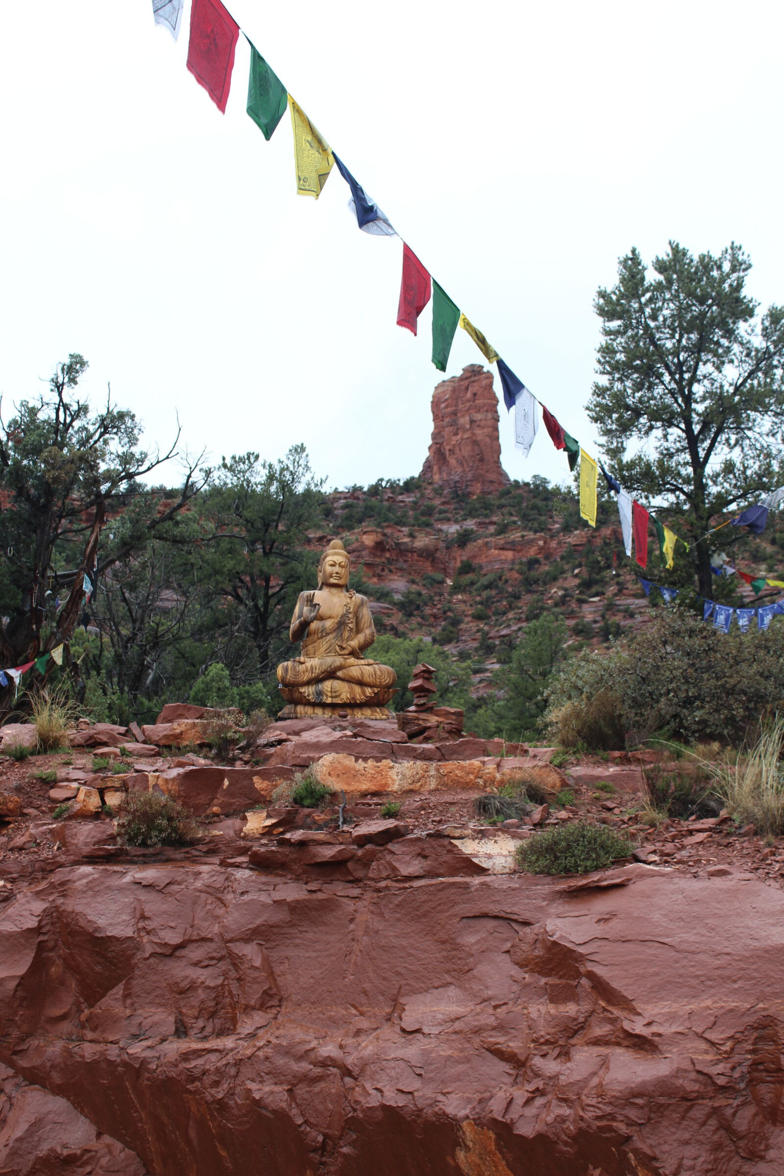 Canon EOS 1200D (EOS Rebel T5 / EOS Kiss X70 / EOS Hi) sample photo. Budha, colors, flags, fog photography