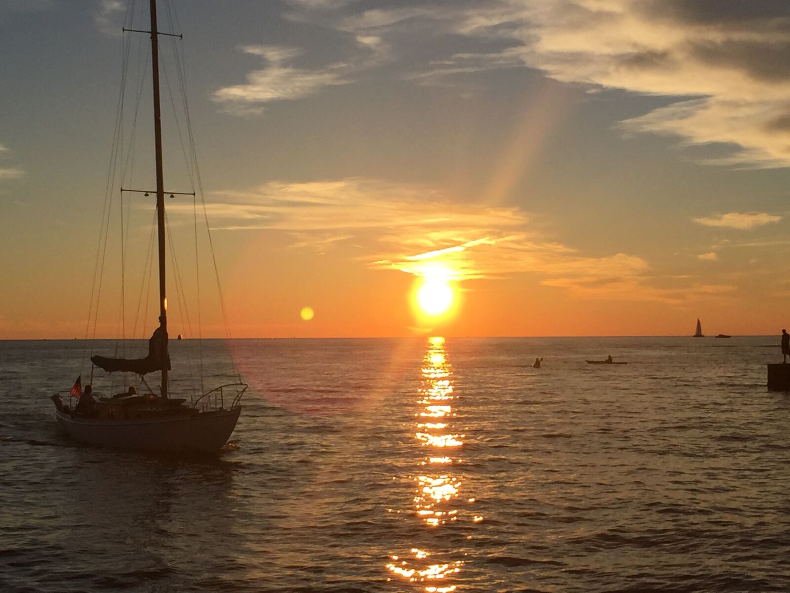 Apple iPhone 6 sample photo. Blue, water, boat, sunset photography
