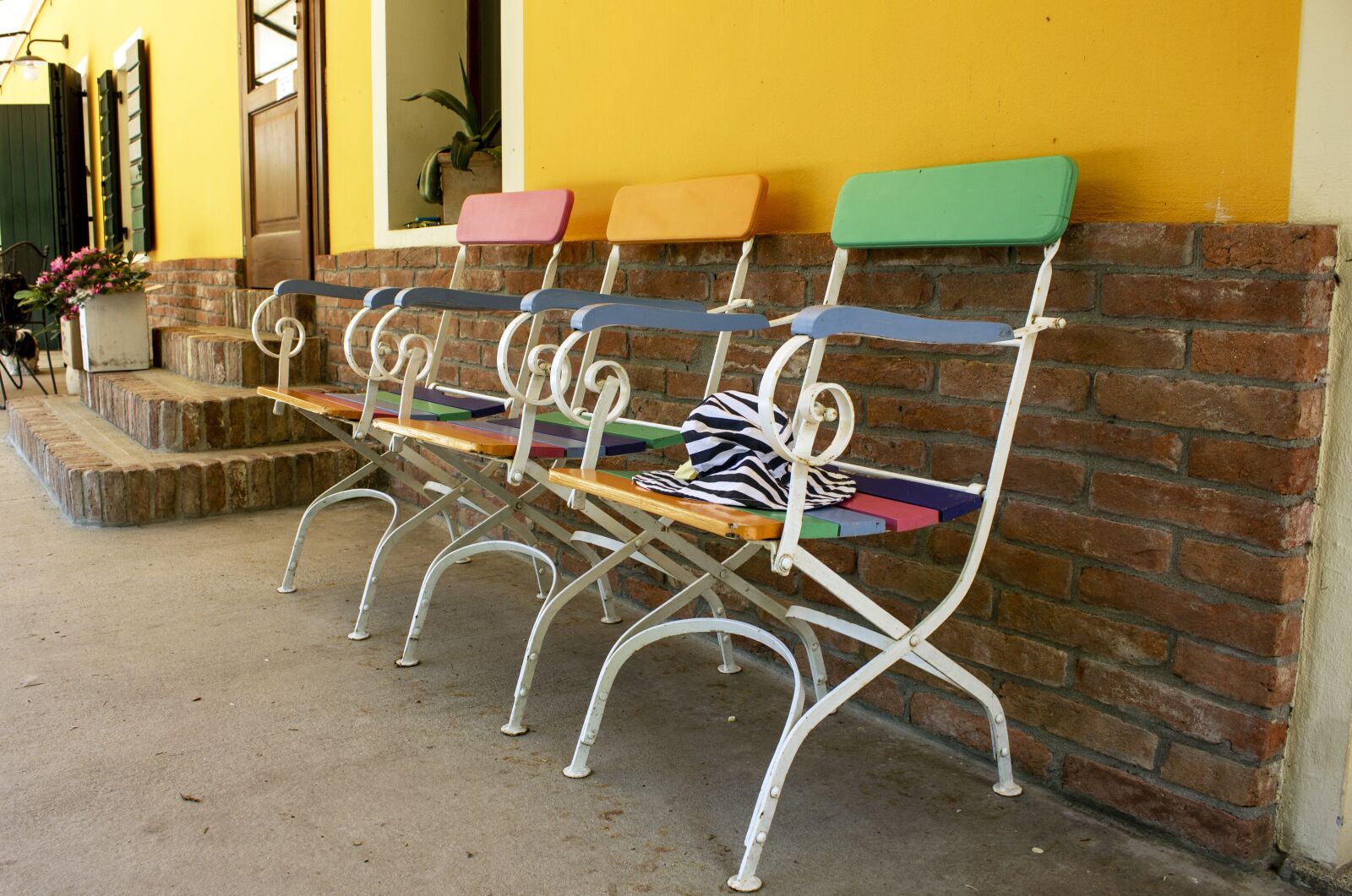 Canon EF-S 18-55mm F3.5-5.6 IS sample photo. Chairs, colorful, exterior photography