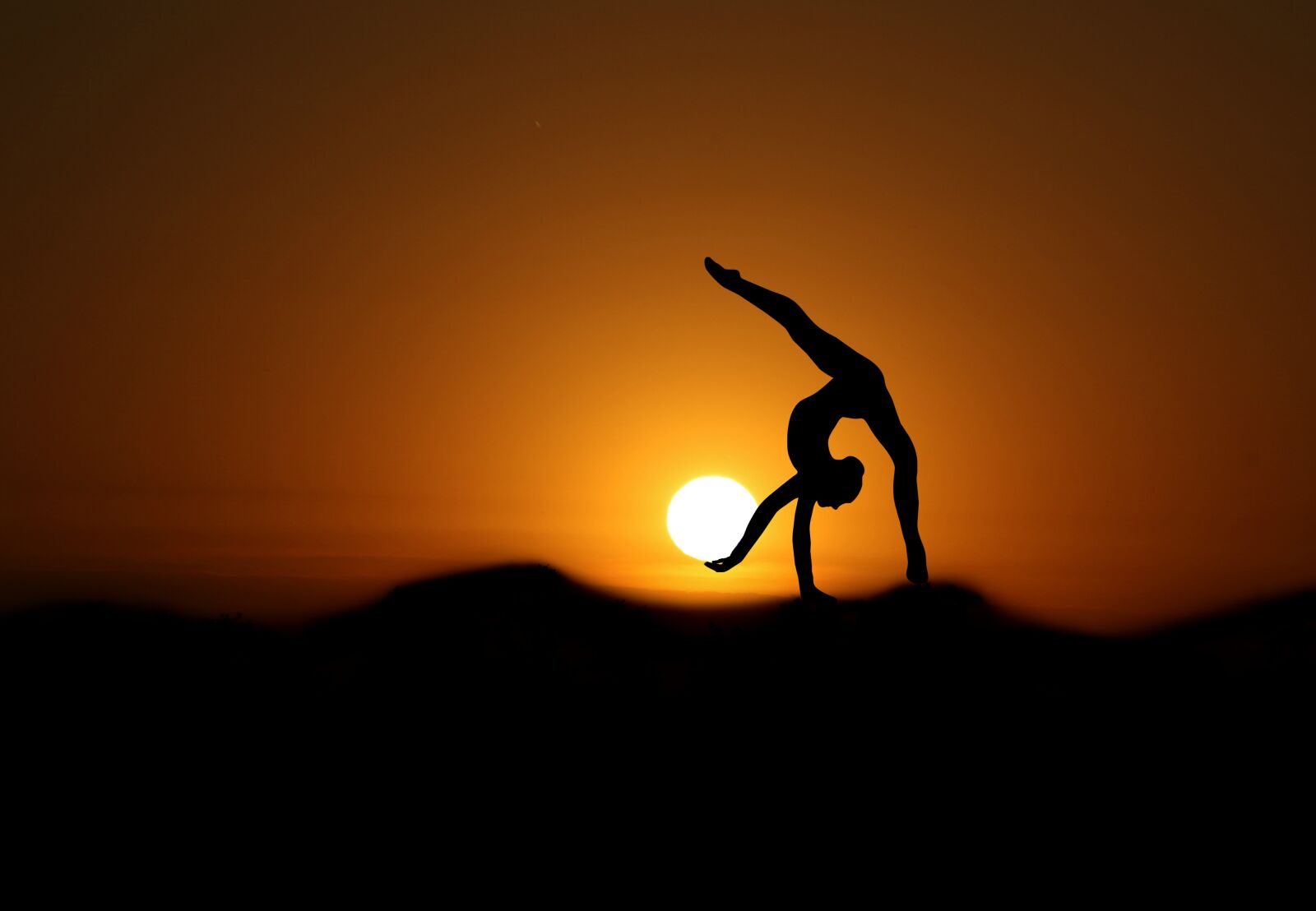 Canon EOS 7D Mark II sample photo. Gymnast, sunset, silhouette photography