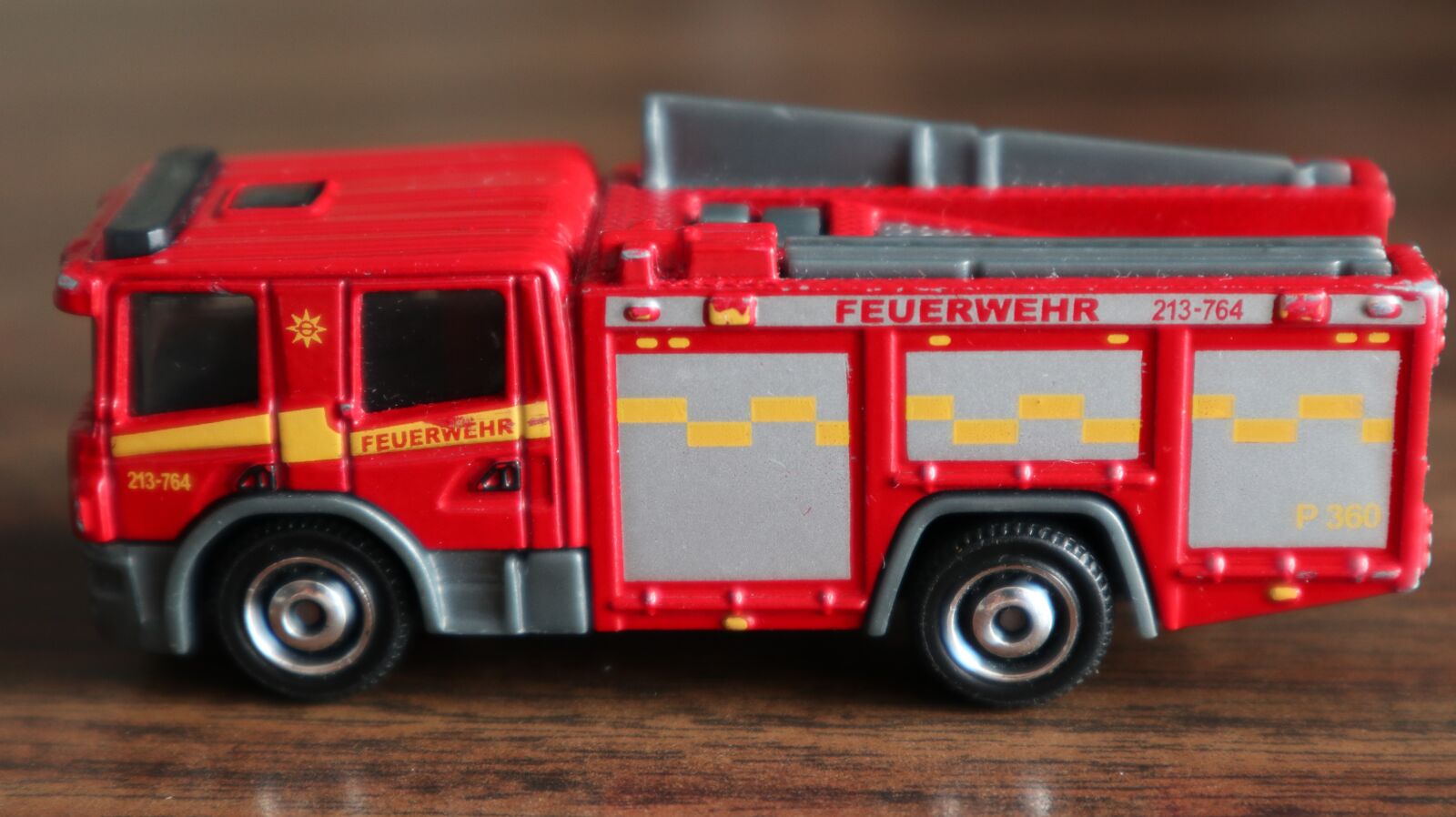 Canon EOS M100 sample photo. Fire truck red, miniature photography