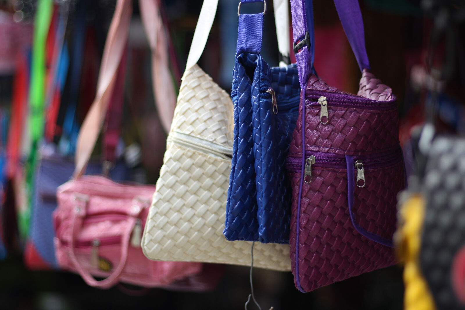 Canon EOS 700D (EOS Rebel T5i / EOS Kiss X7i) + Canon EF 50mm F1.8 STM sample photo. Bags, blue, pink, purple photography