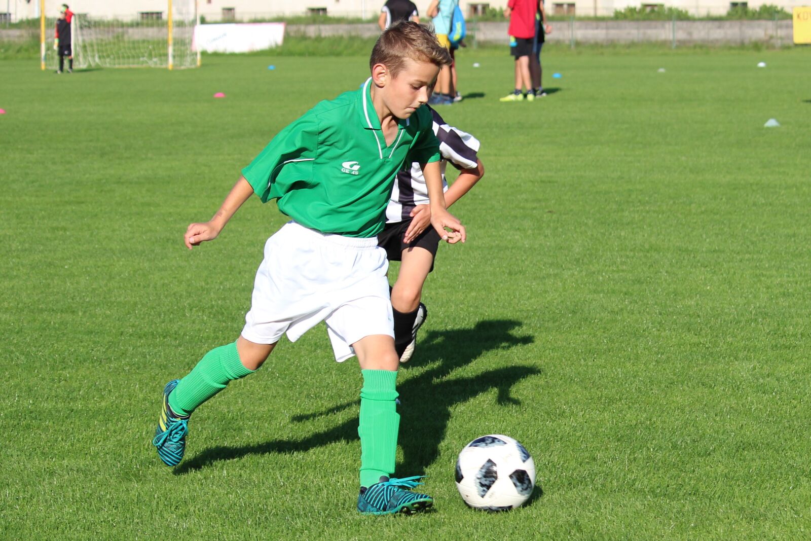 Canon EF-S 55-250mm F4-5.6 IS STM sample photo. Football, younger pupils, pupils photography