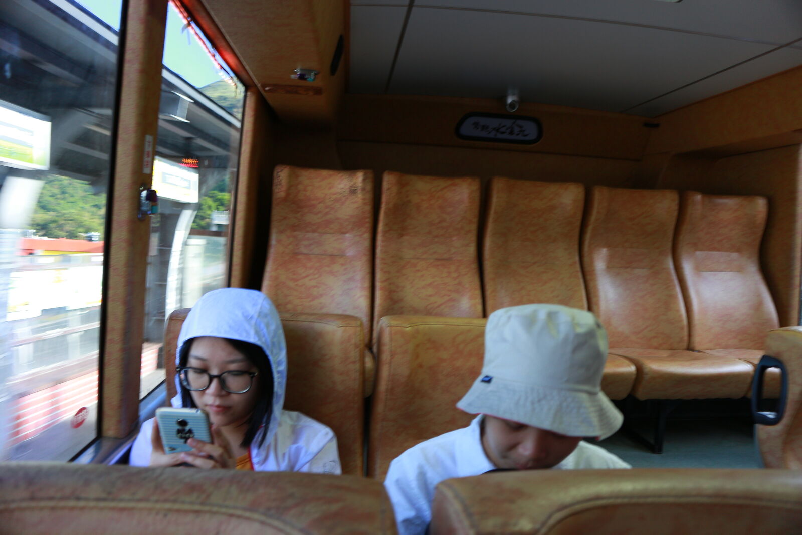 Canon EOS M sample photo. Man, sitting, in, bus photography