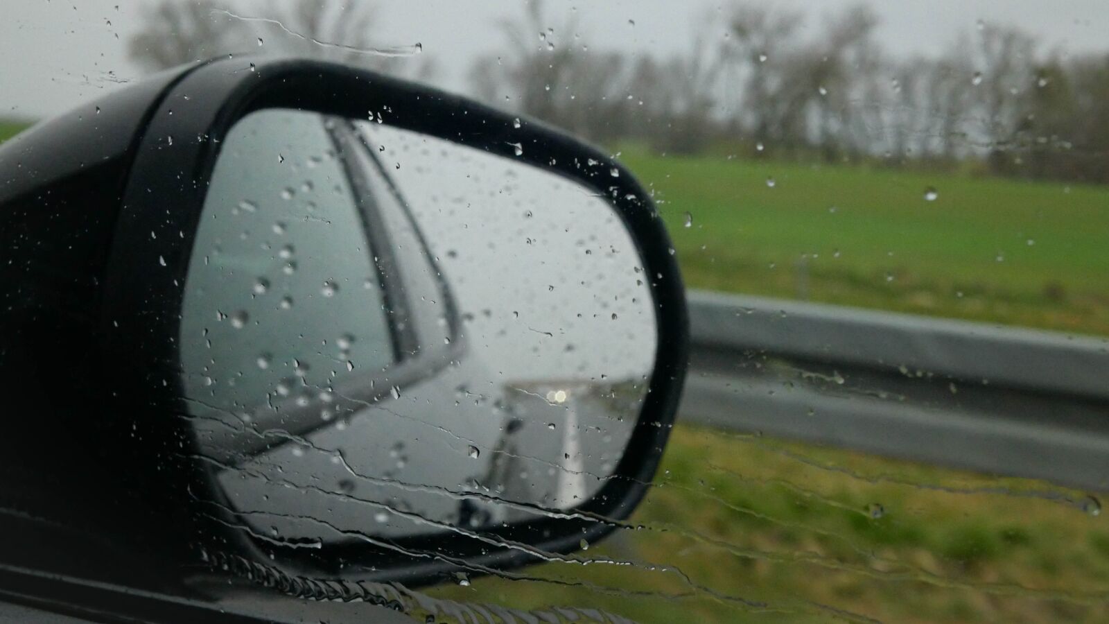 LUMIX G 25/F1.7 sample photo. Rearview mirror, car, rain photography