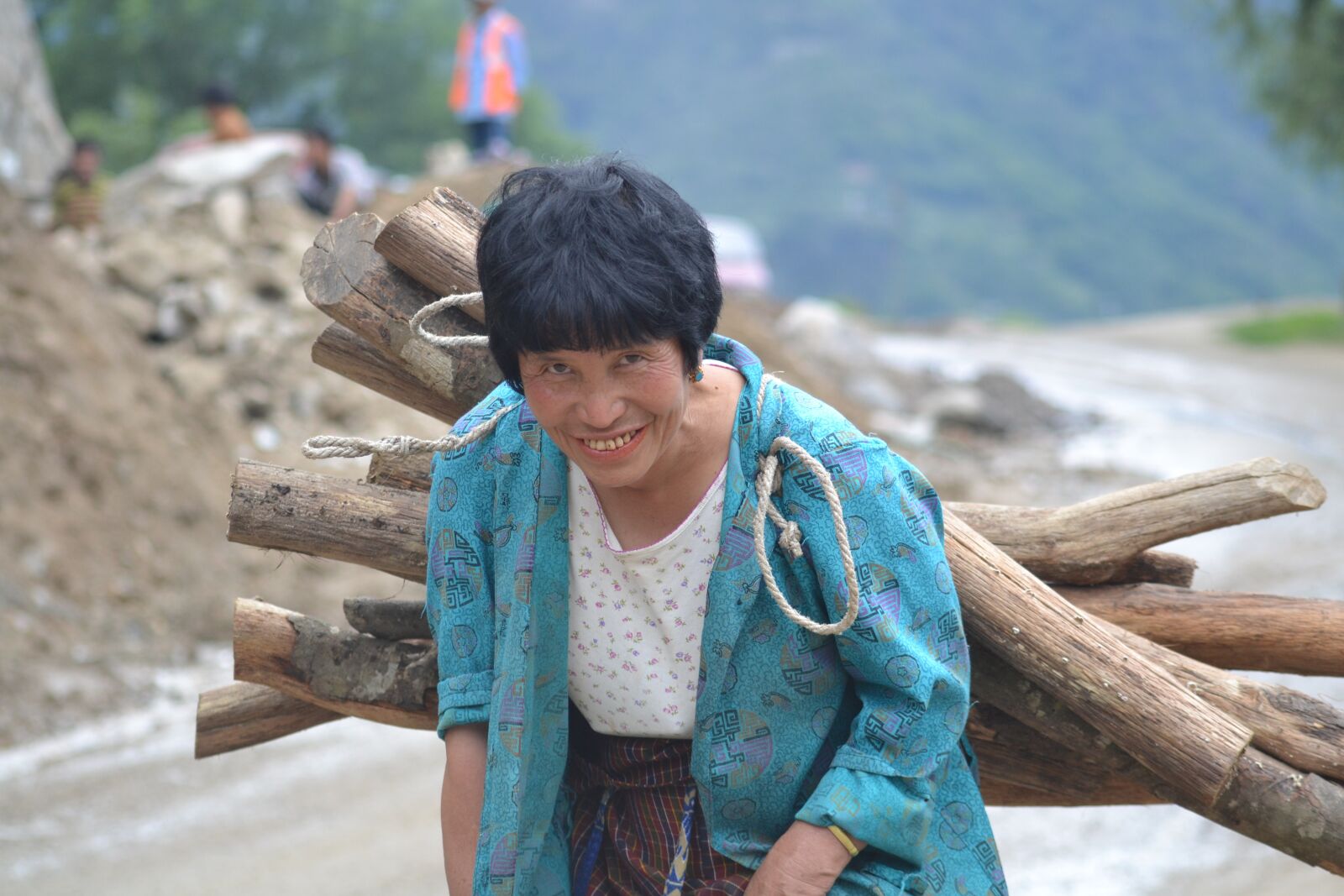 Nikon D3100 sample photo. Working, woman, carrying photography