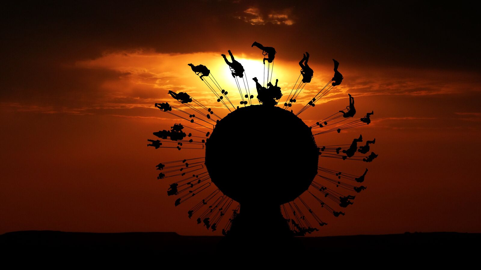 Panasonic Lumix DMC-FZ200 sample photo. Sunset, carousel, game photography