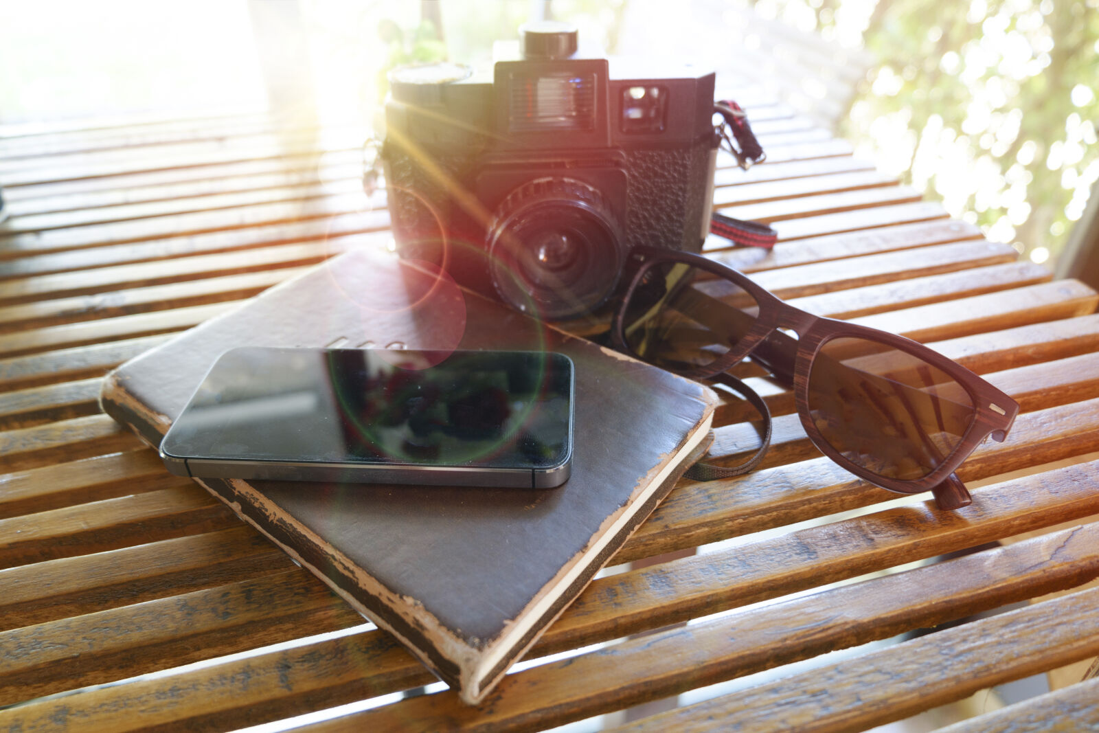 Fujifilm X-A2 sample photo. Book, camera, daylight, iphone photography