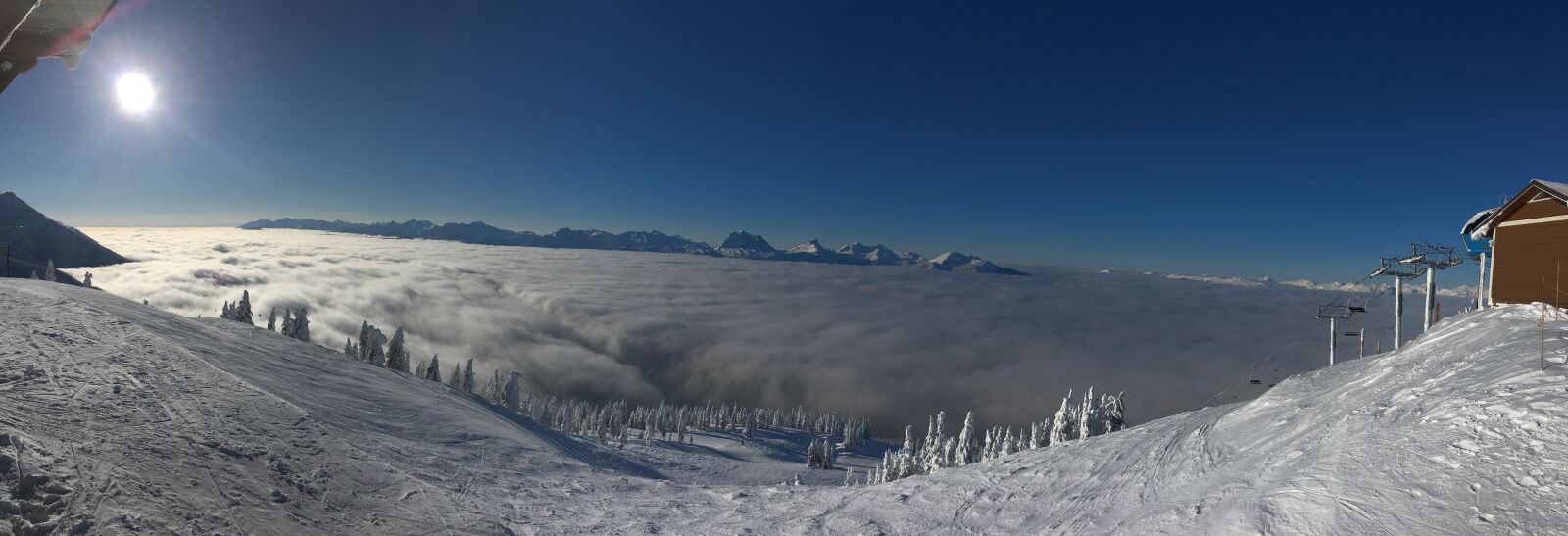 iPhone SE back camera 4.15mm f/2.2 sample photo. Snow, resort, clouds photography