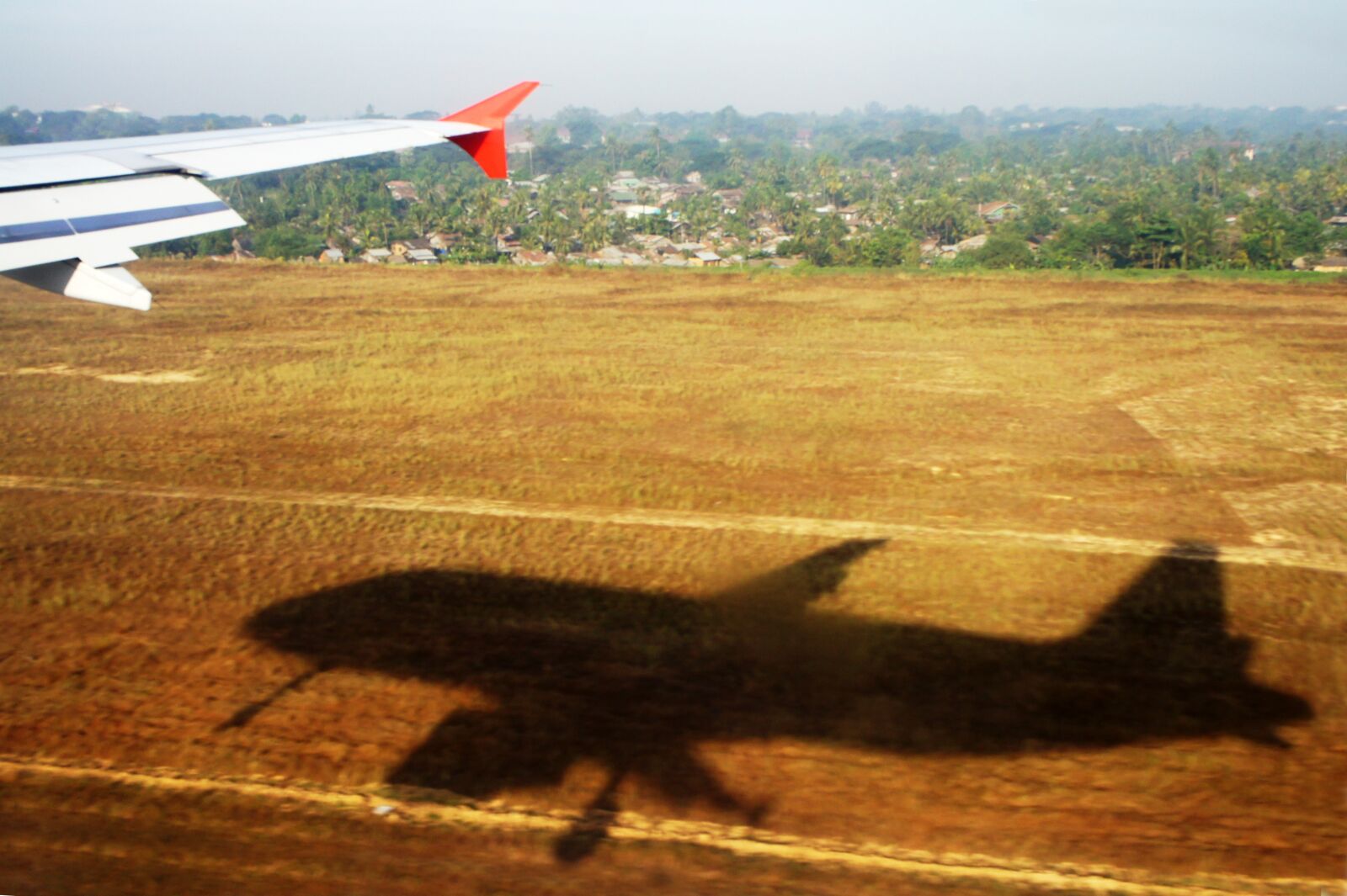 Sony Alpha NEX-5 + Sony E 18-55mm F3.5-5.6 OSS sample photo. Aircraft, shadow, field photography
