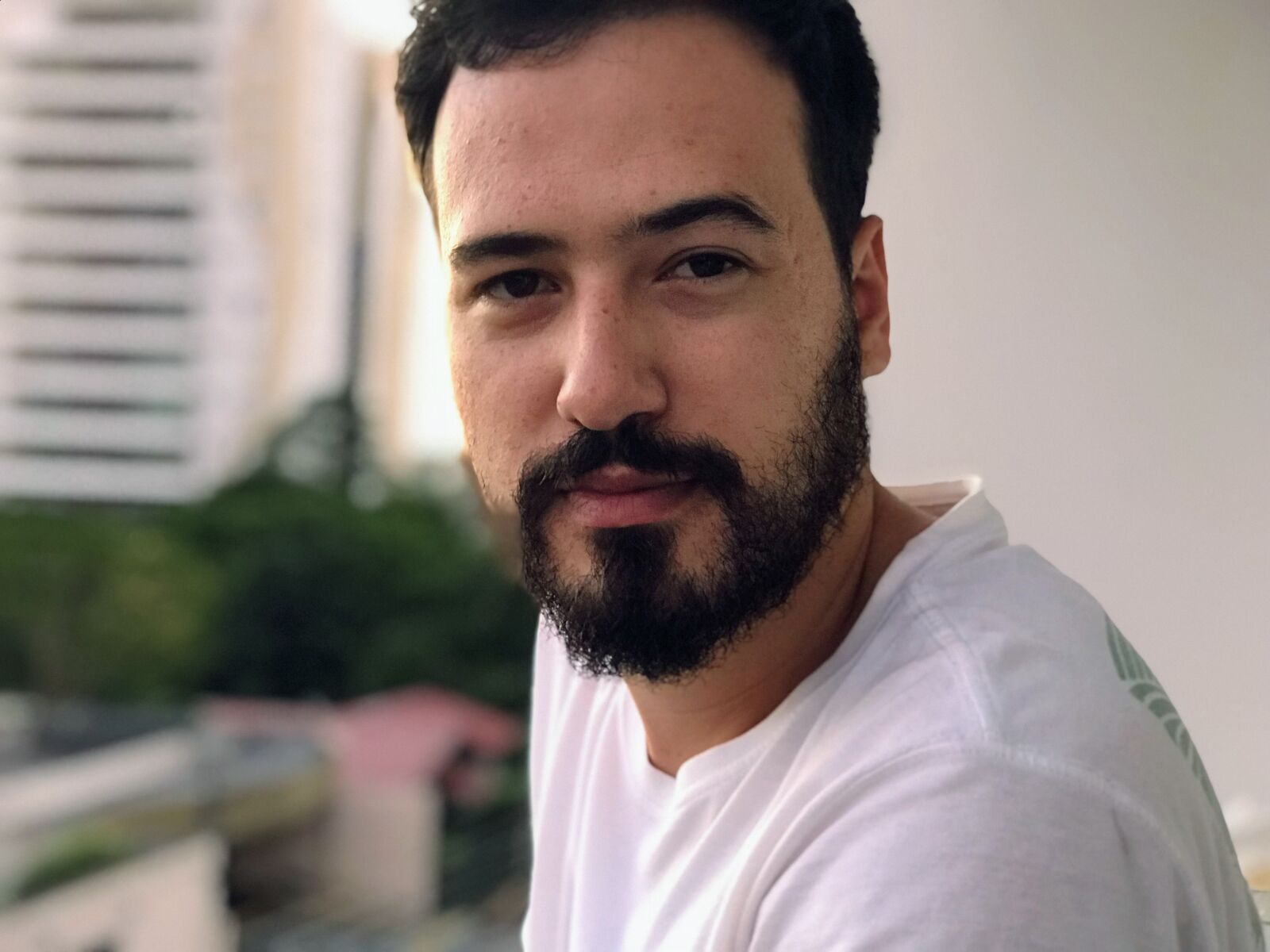 Apple iPhone 7 Plus sample photo. Adult, beard, blur, building photography