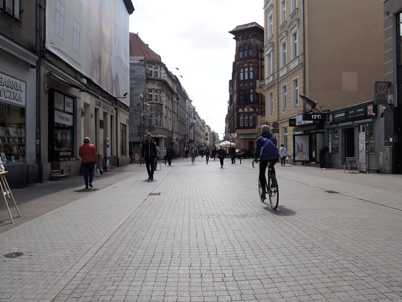 Olympus PEN E-PL6 sample photo. Poznan, street, cyclist photography