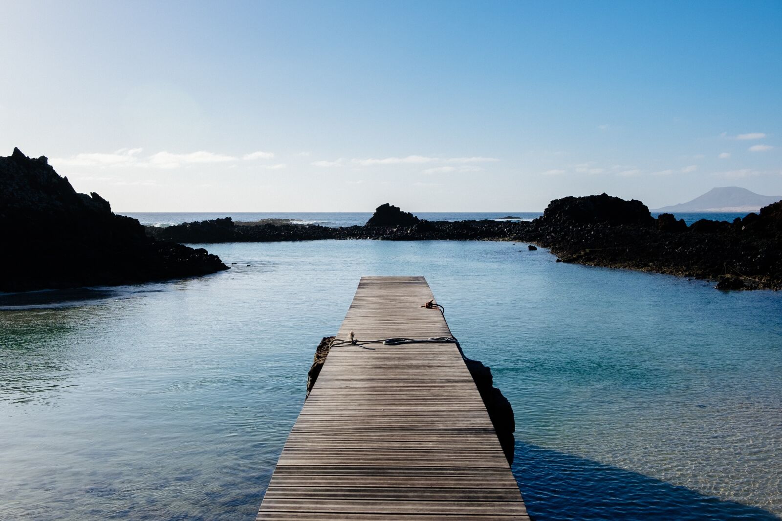 Fujifilm X-T10 sample photo. Dock, ocean, rocks photography