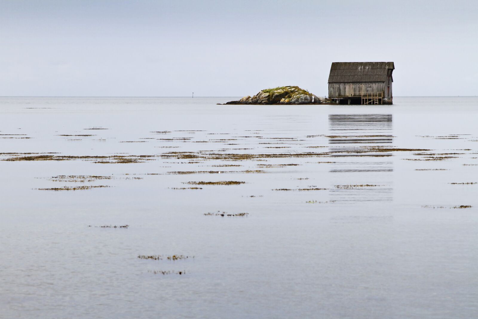 Canon EOS 7D + Canon EF 24-105mm F4L IS USM sample photo. Boathouse, sea, sky photography