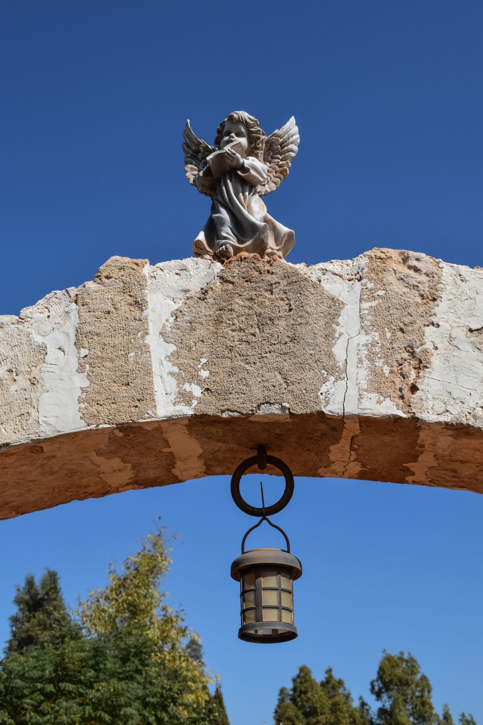 Nikon D3300 sample photo. Gate, angel, hanging lamp photography