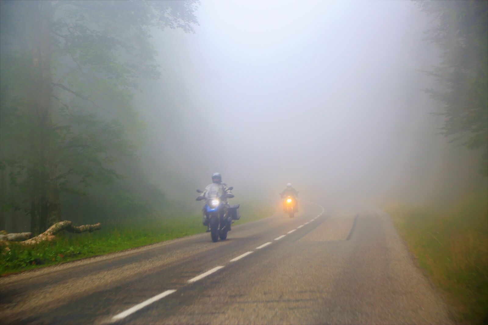 Canon EF 24-105mm F4L IS USM sample photo. Motorcycle, road, fog photography