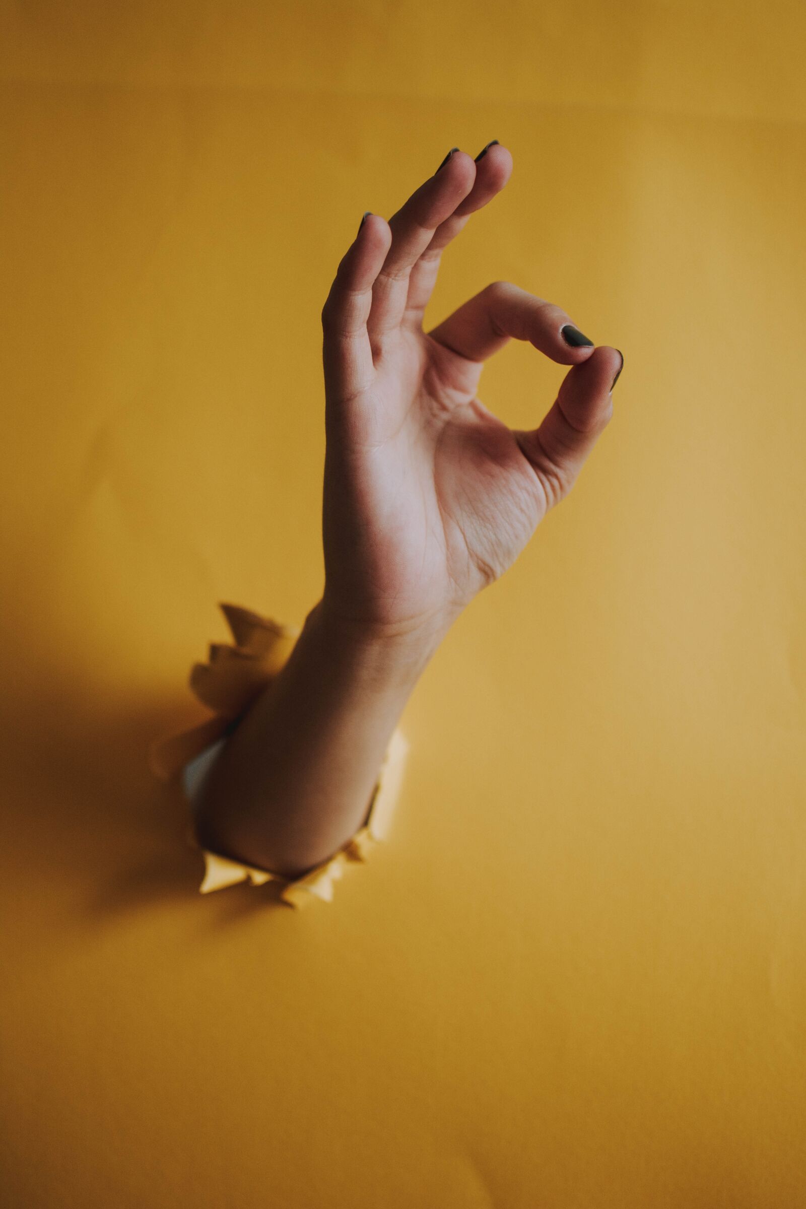 Nikon D5200 sample photo. Hand, yellow, hole photography