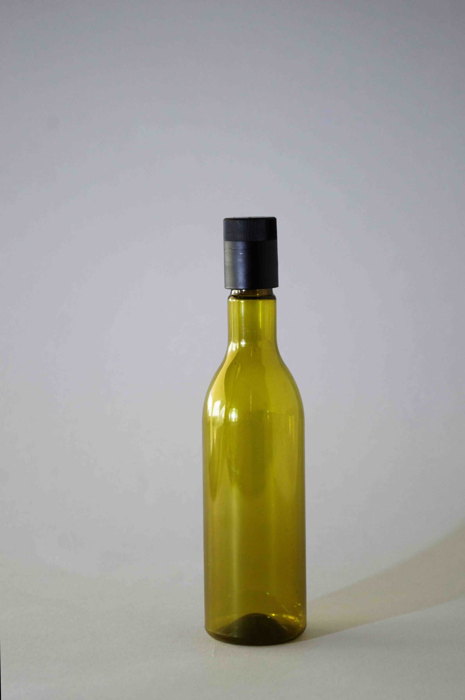 Nikon D3100 sample photo. Isolated, plastic bottle, pet photography