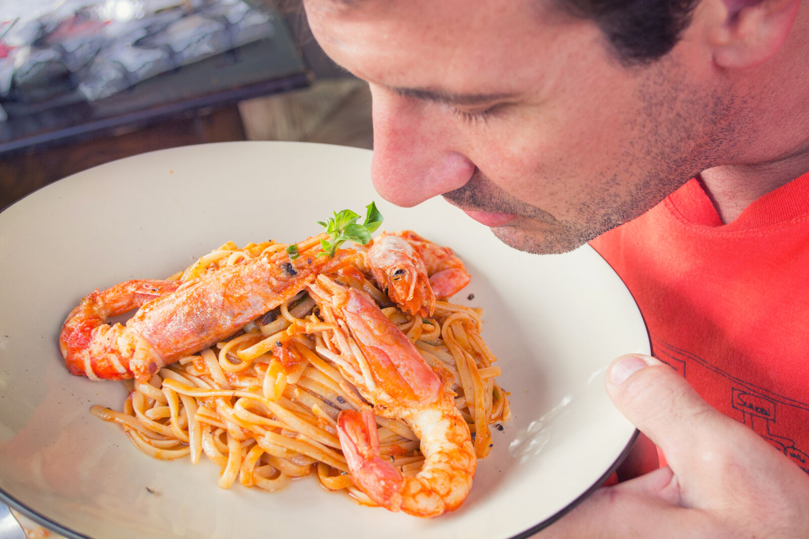 Nikon D3100 sample photo. Man, smelling, prawn, and photography