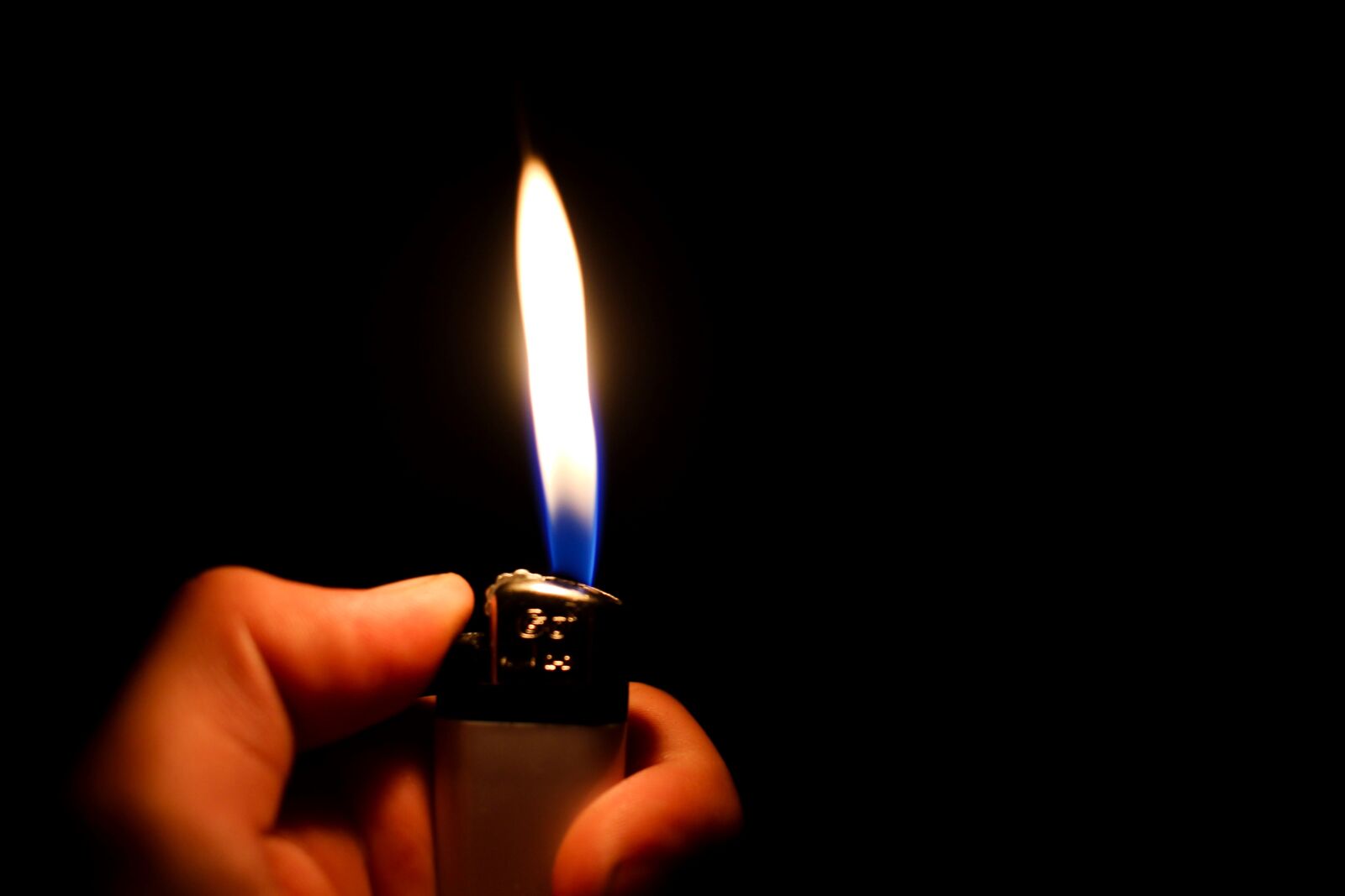 Canon EF-S 24mm F2.8 STM sample photo. Lighter, flame, fire photography