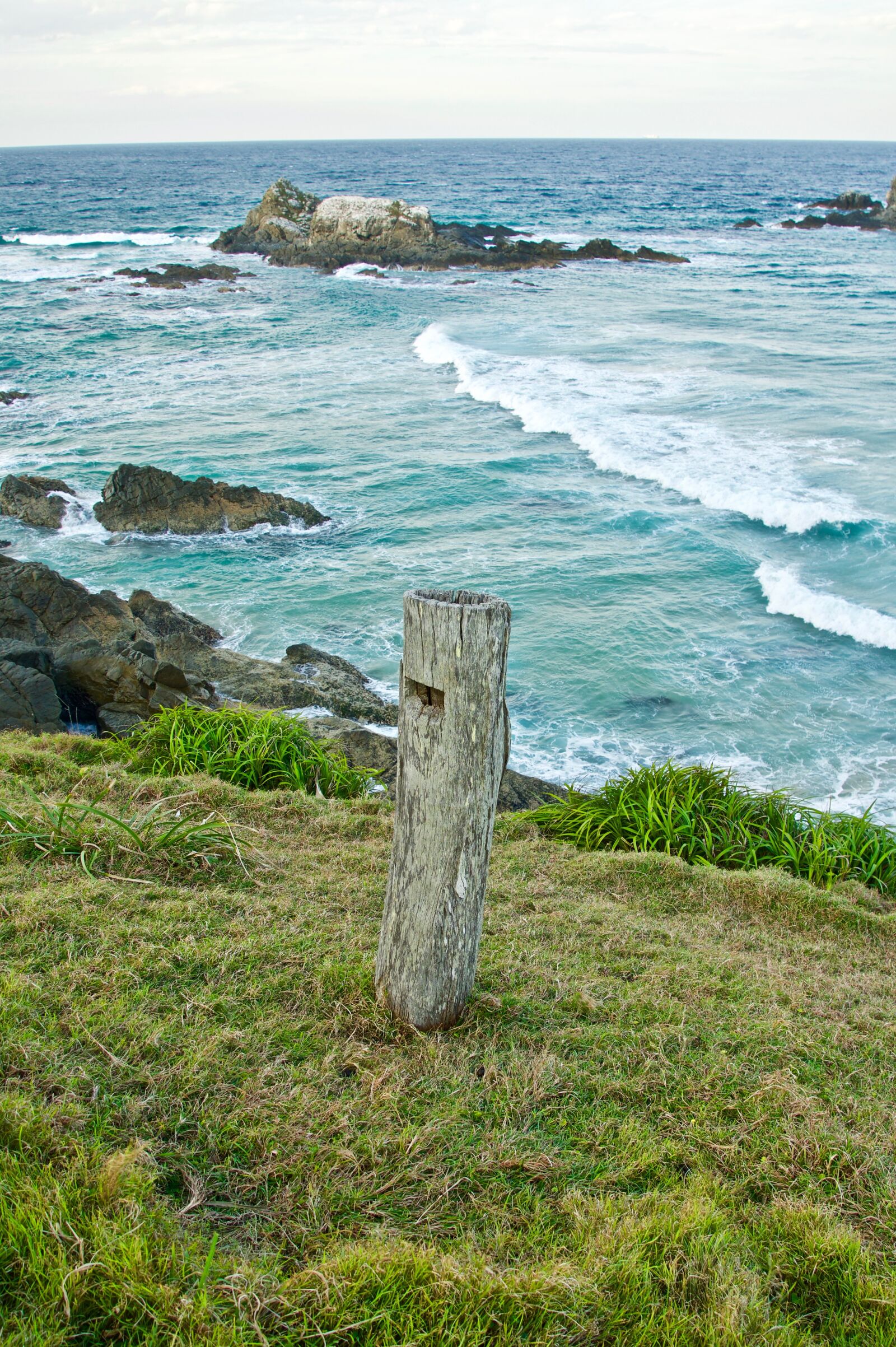 Sony E 18-135mm F3.5-5.6 OSS sample photo. Post, coast, lone photography