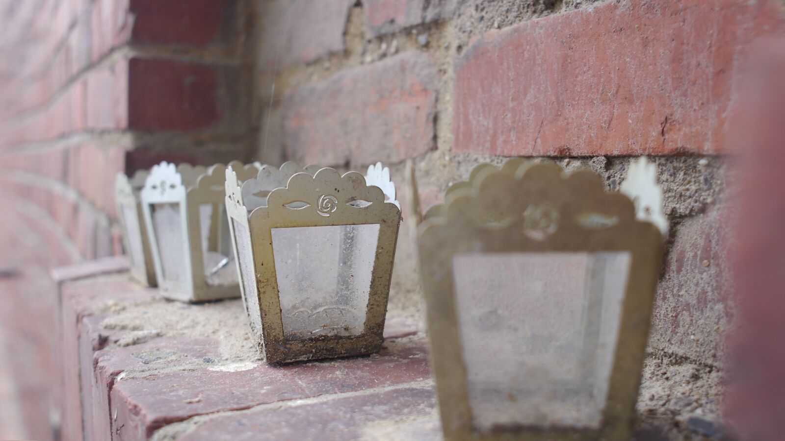 Panasonic Lumix DMC-GH2 sample photo. Candle, brick, old photography