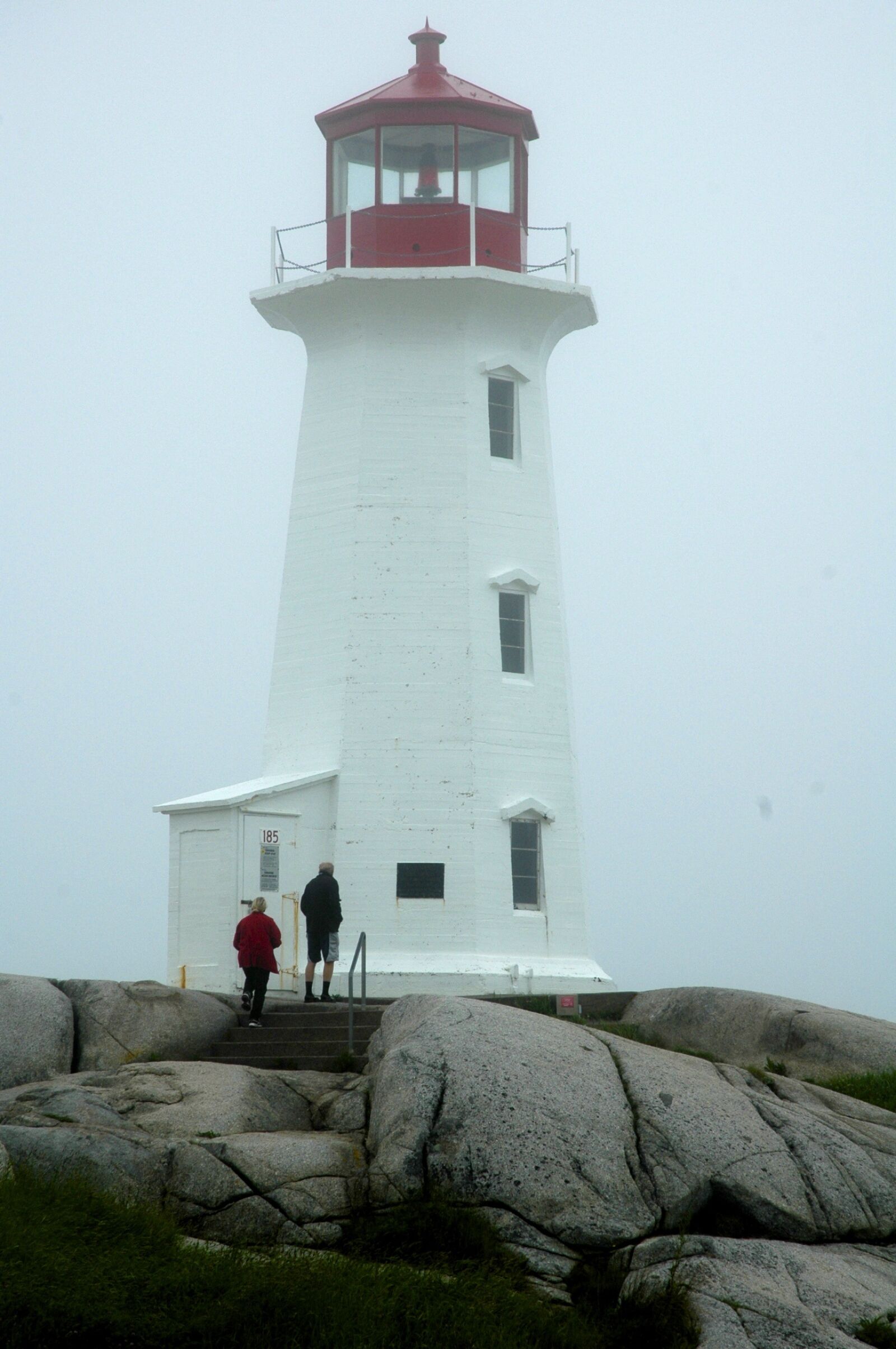 Nikon D70s sample photo. Lighthouse, fog, rocks photography