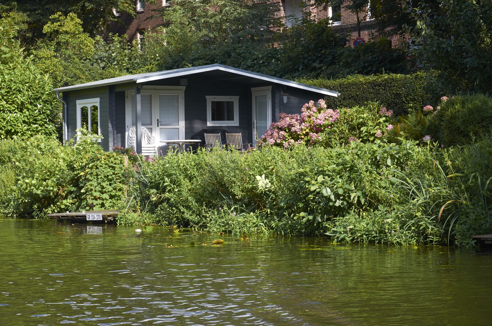 Nikon D7000 sample photo. Small house, water's edge photography