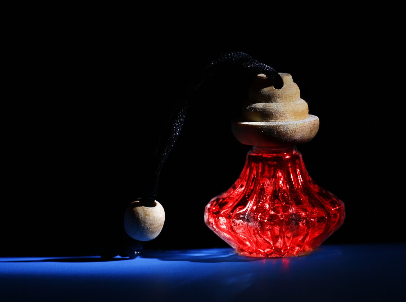 Canon EOS 1000D (EOS Digital Rebel XS / EOS Kiss F) sample photo. Fragrance, bottle, red photography