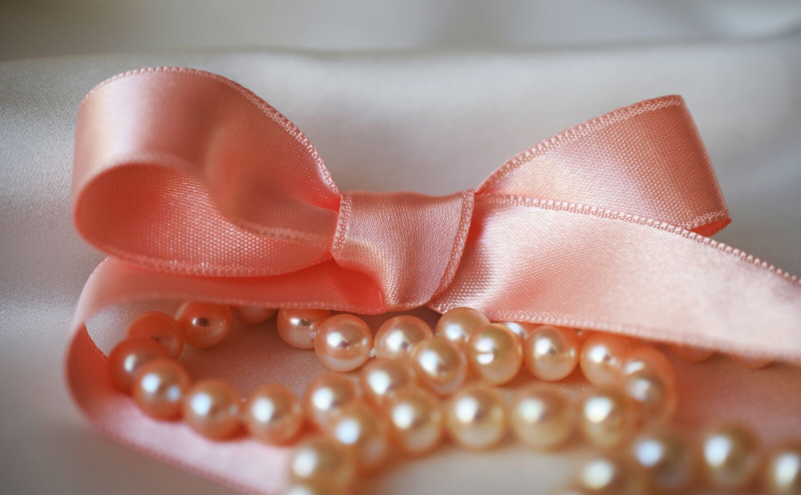 Nikon D5300 sample photo. Ribbon, pearls, white photography