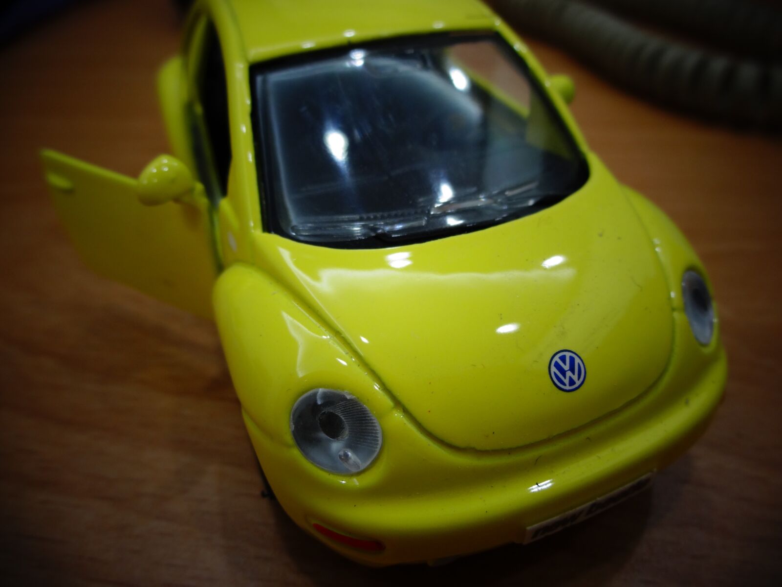 Sony DSC-WX100 sample photo. Toy car, yellow, mini photography