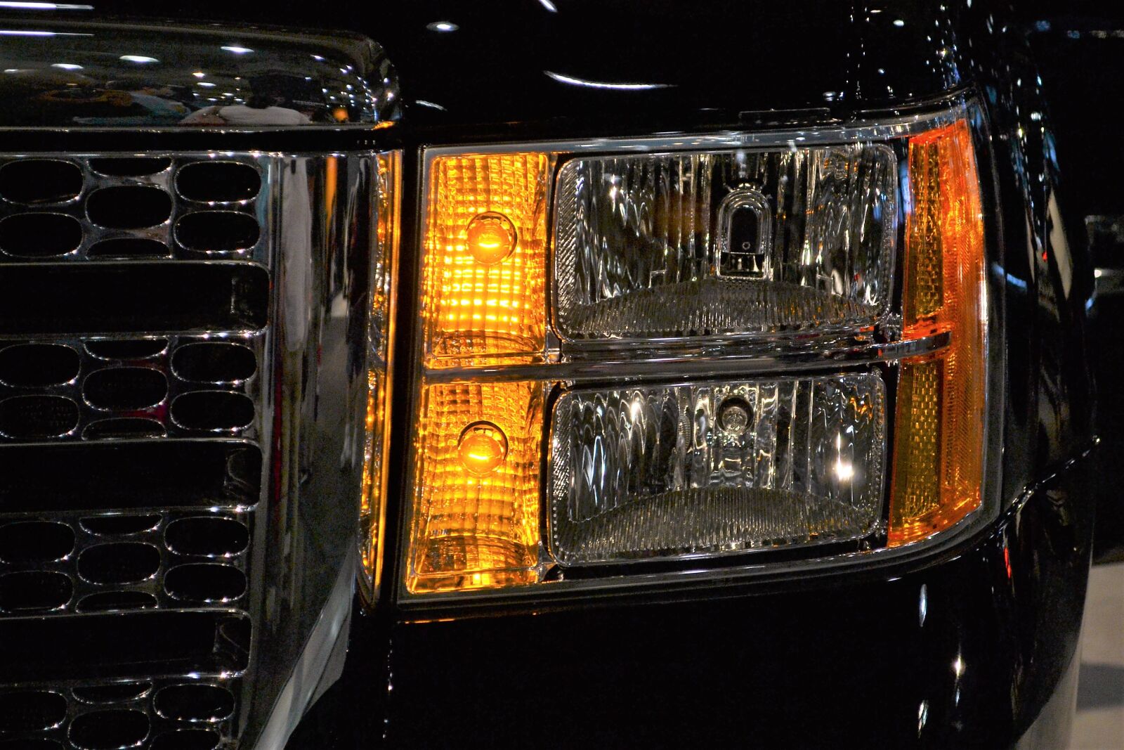 Nikon D3100 sample photo. Black suv, headlamp, black photography