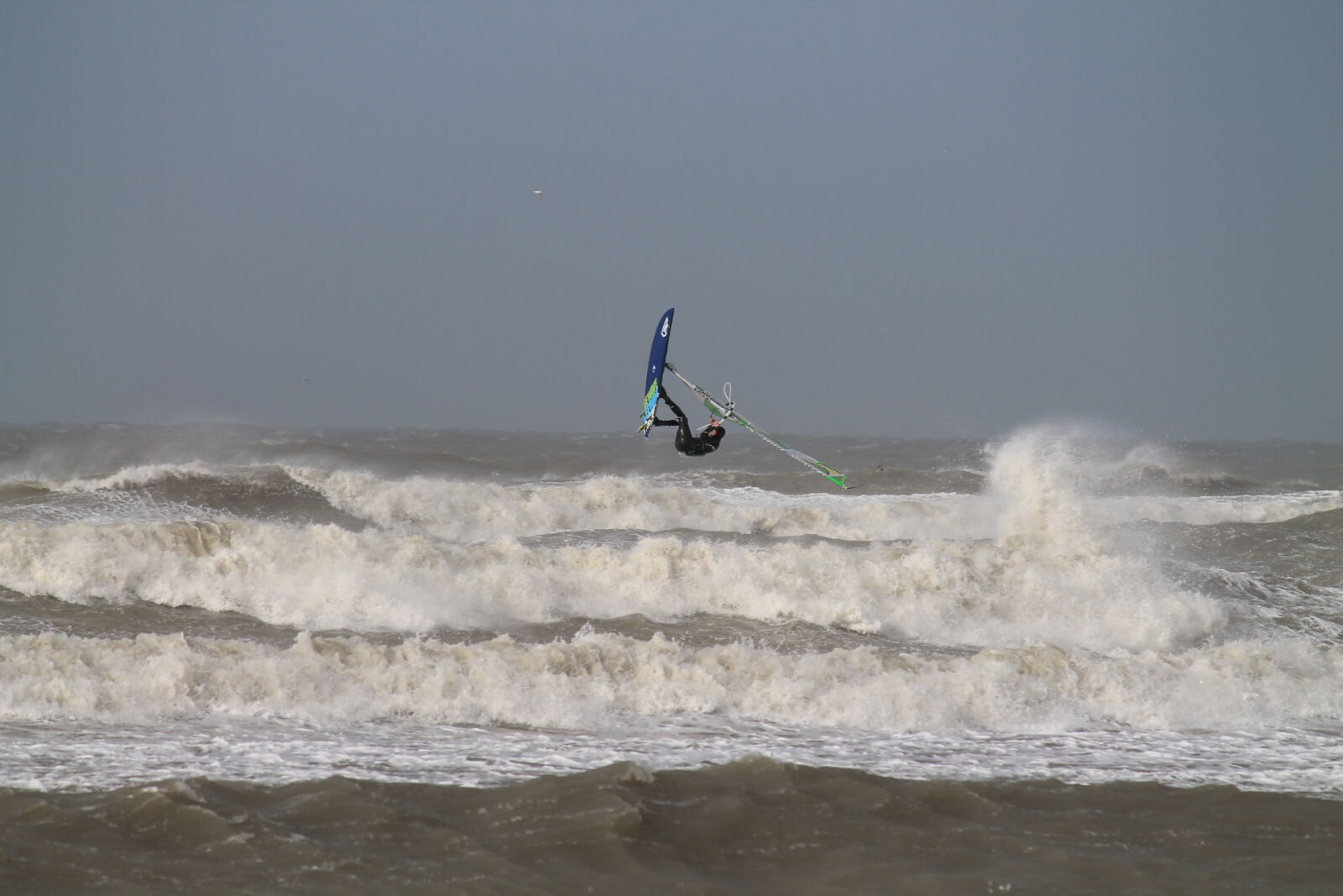 Canon EF-S 55-250mm F4-5.6 IS II sample photo. Beach, jump, man, ocean photography