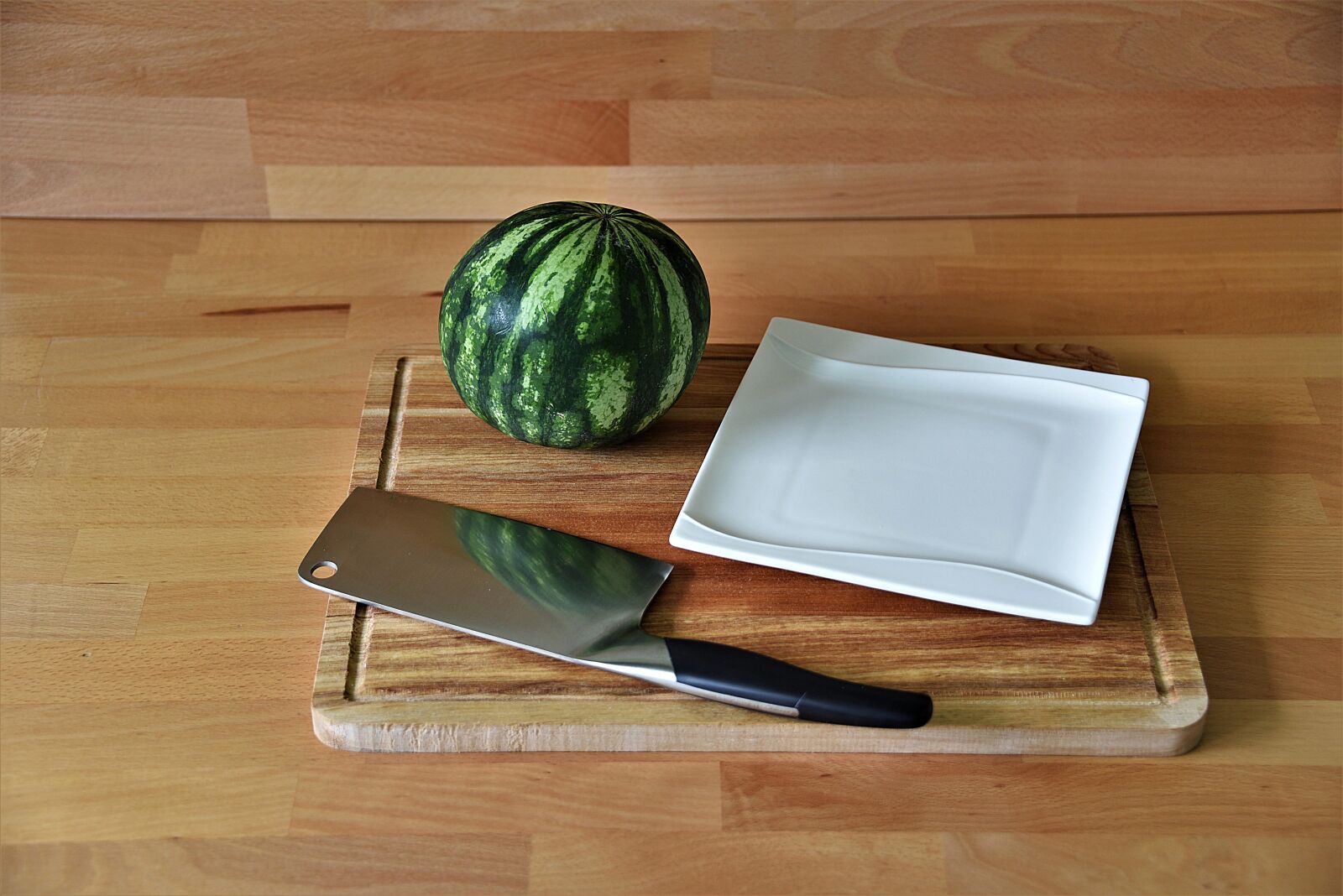 Nikon D750 sample photo. Cleaver, melon, plate photography