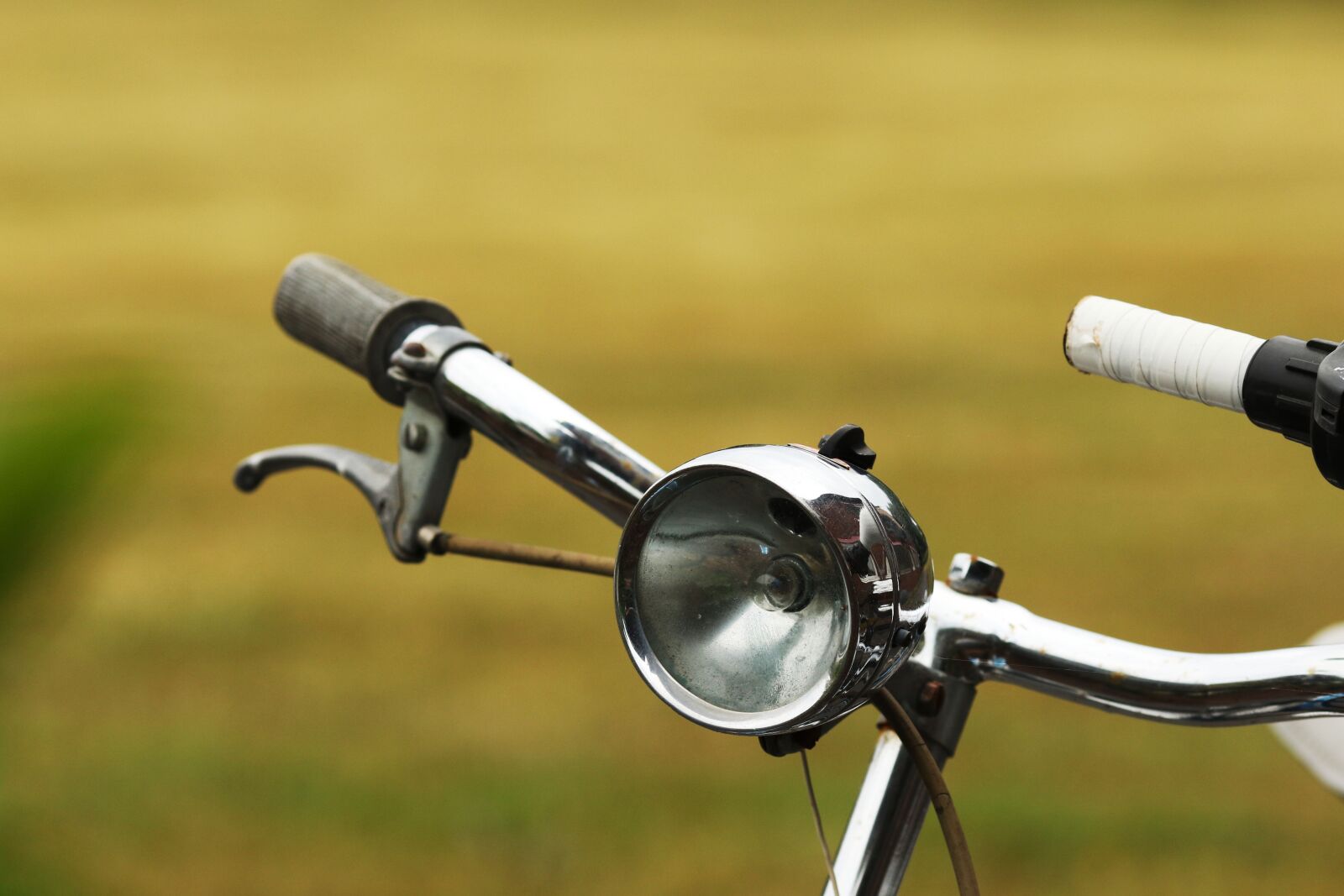 Canon EOS 7D Mark II + Canon EF 135mm F2L USM sample photo. Steering wheel, bike, old photography