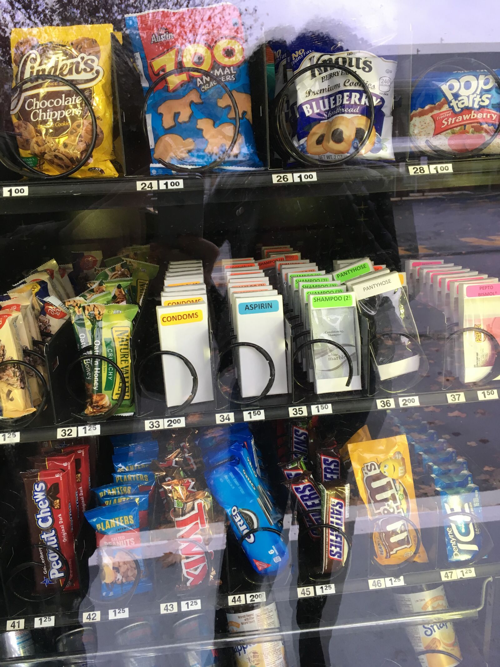 iPhone SE back camera 4.15mm f/2.2 sample photo. Vending machine, snacks, condoms photography