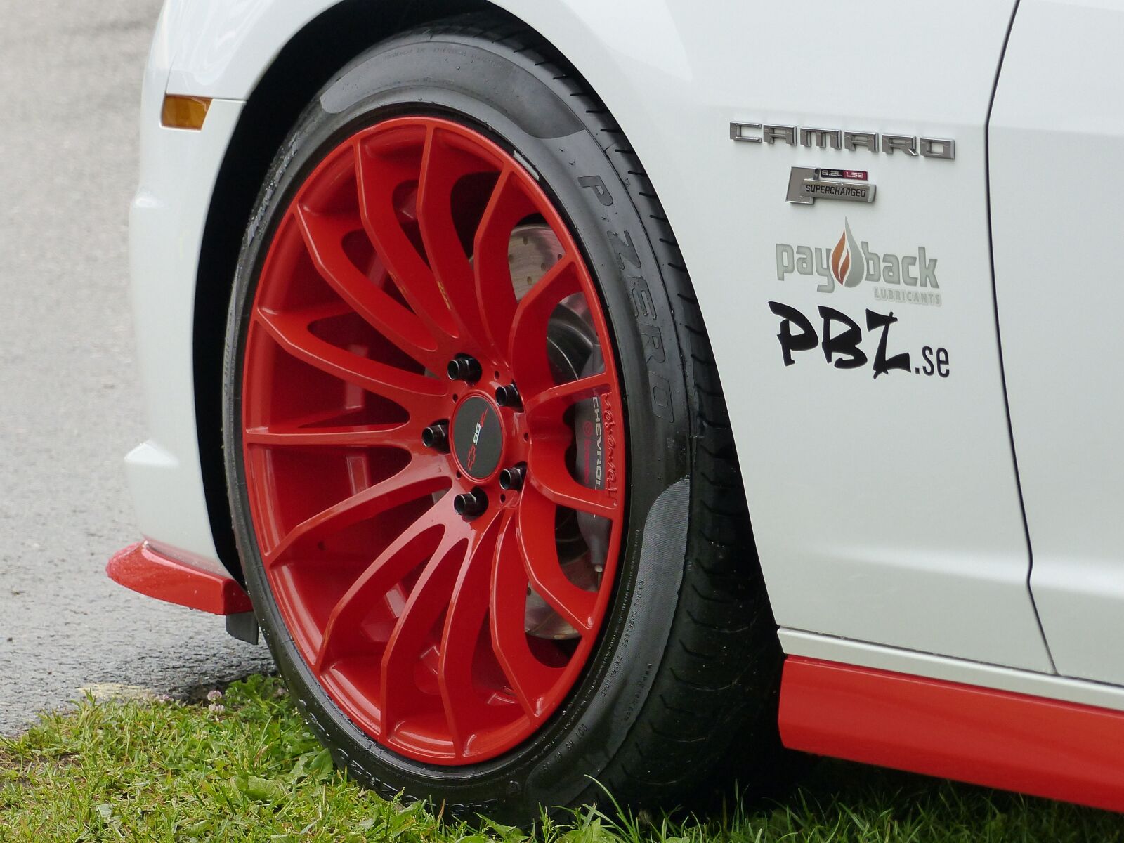 Panasonic Lumix DMC-FZ200 sample photo. Rim, red, car photography