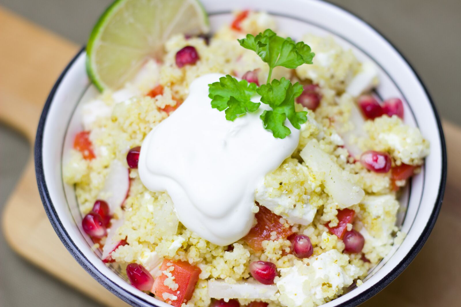 Canon EOS 600D (Rebel EOS T3i / EOS Kiss X5) + Canon EF 50mm F1.8 STM sample photo. Salad, couscous, pomegranate photography