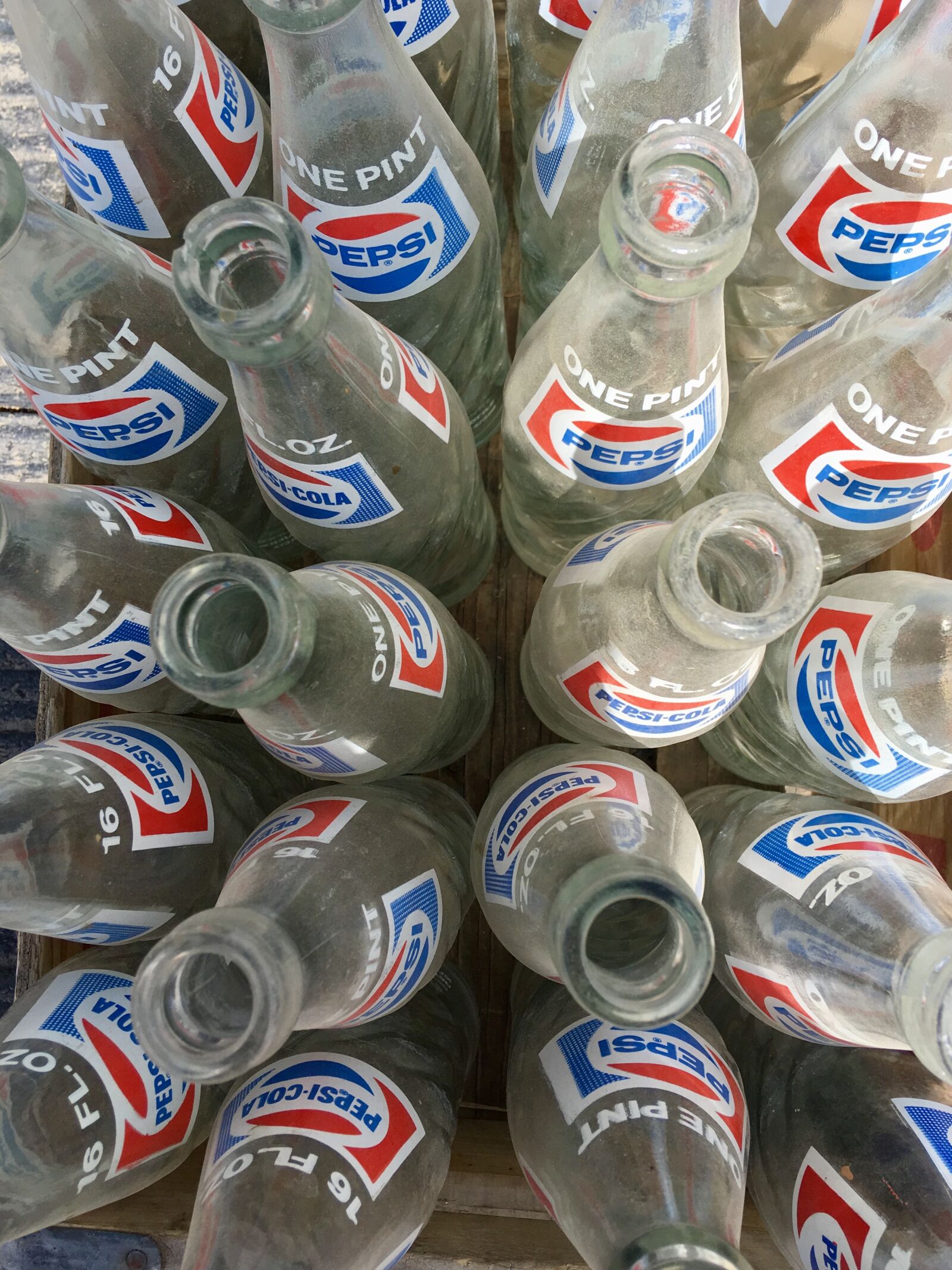 iPhone SE back camera 4.15mm f/2.2 sample photo. Pepsi, bottles, dusty photography