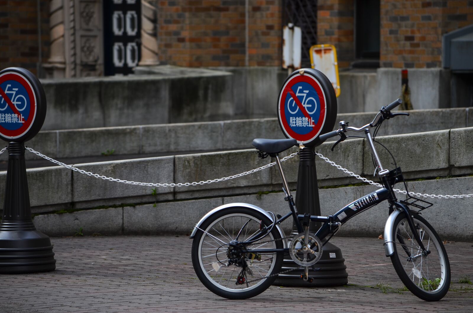 Nikon D5100 sample photo. Bike, street, sign photography