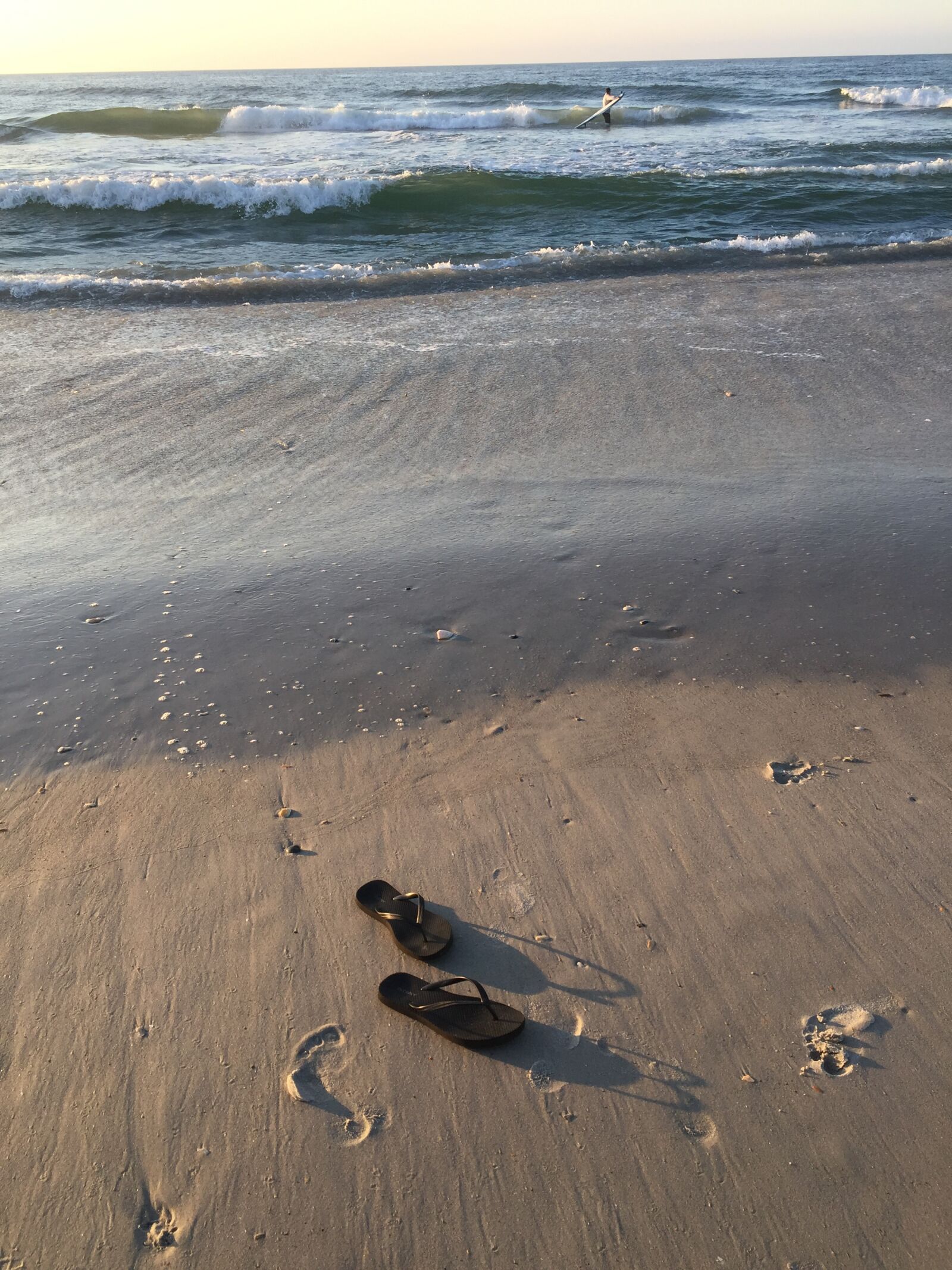iPhone 6 back camera 4.15mm f/2.2 sample photo. Ocean, beach, flip flops photography