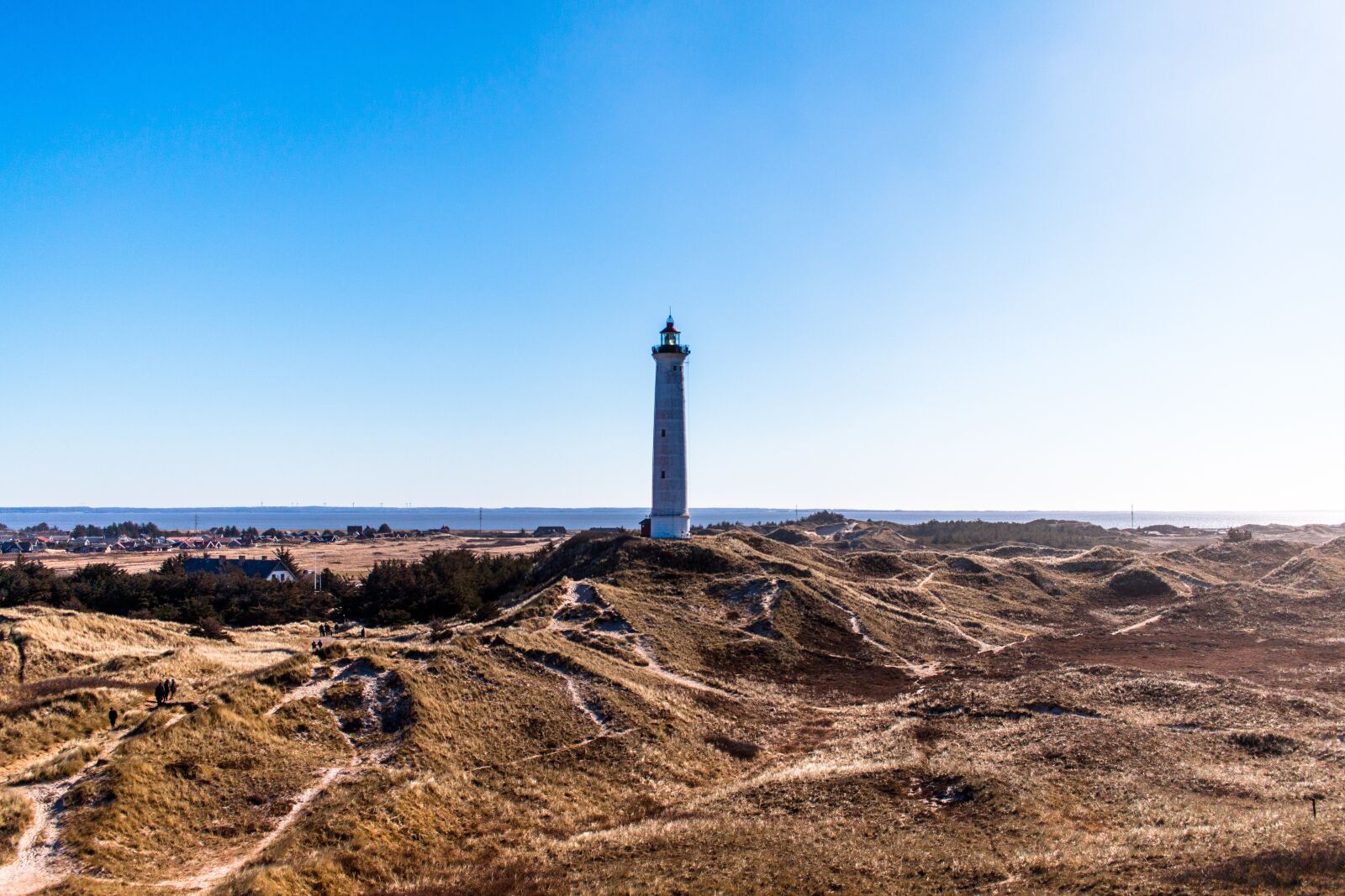 Canon EF-S 24mm F2.8 STM sample photo. Lighthouse, blue sky, coast photography