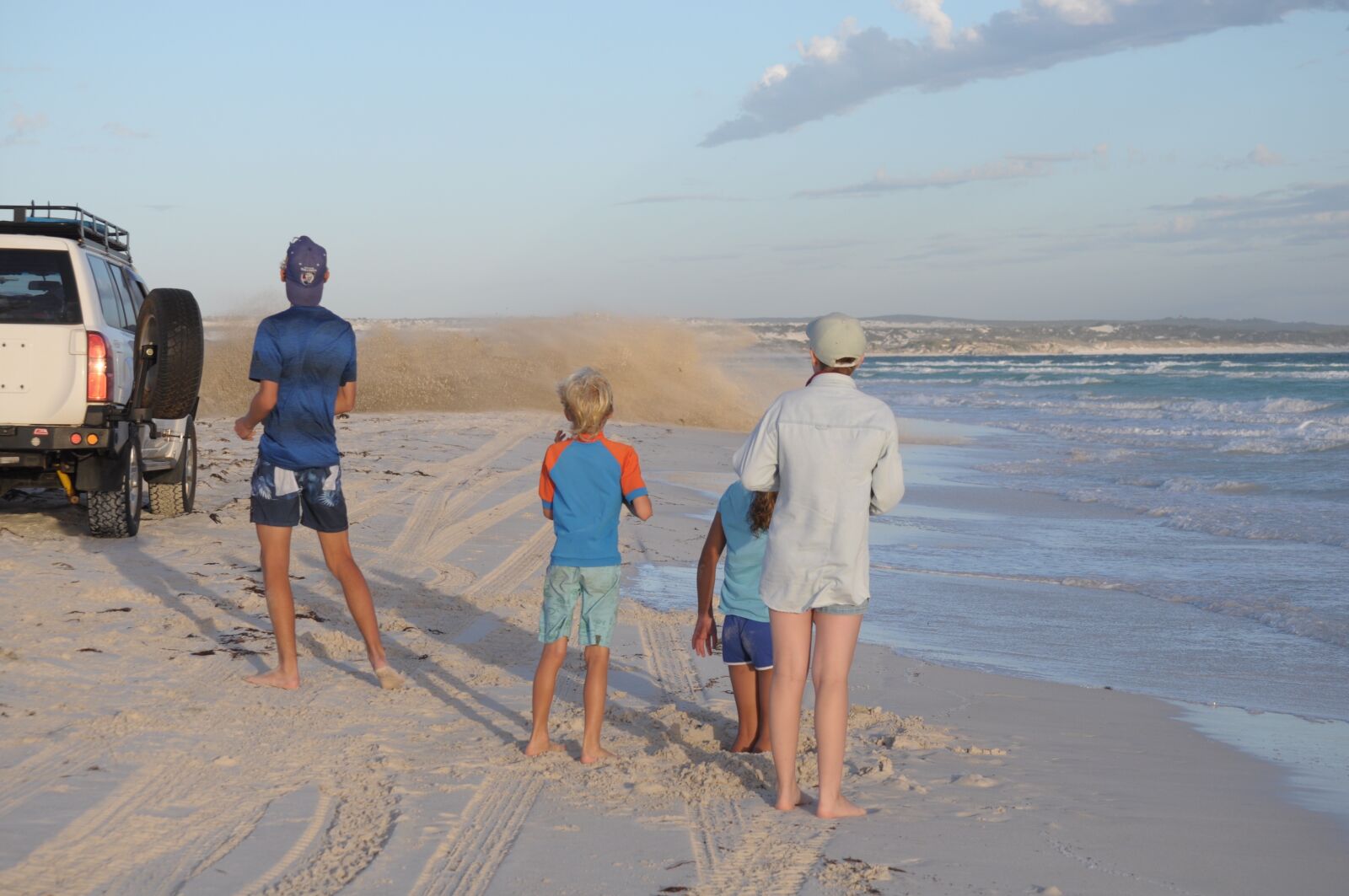 Nikon D5000 sample photo. Beach party, sand, spray photography