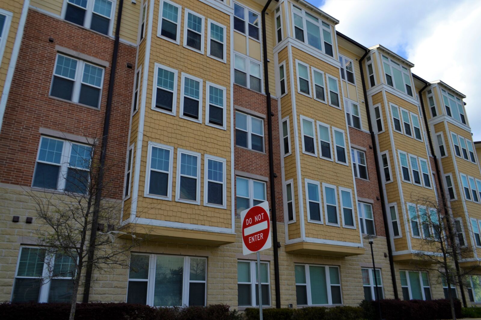 Nikon D3100 sample photo. Apartment building, affordable, housing photography