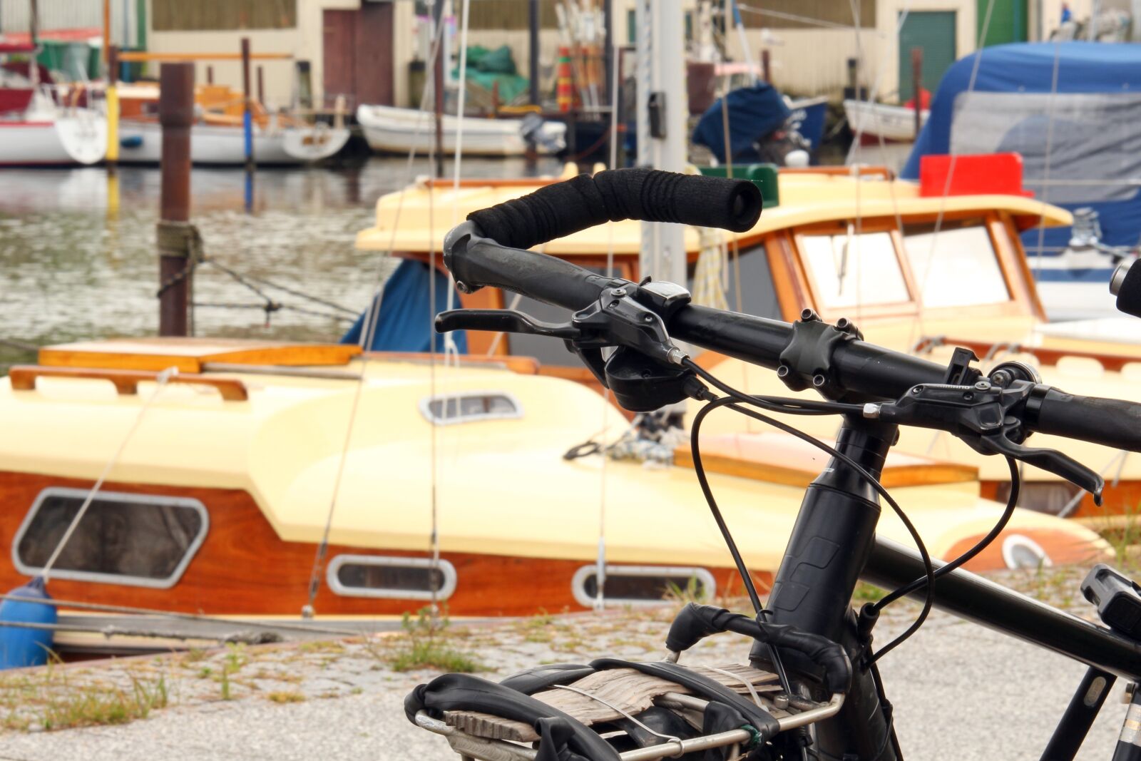 Canon EF-S 55-250mm F4-5.6 IS STM sample photo. Bike, sailing boats, landscape photography