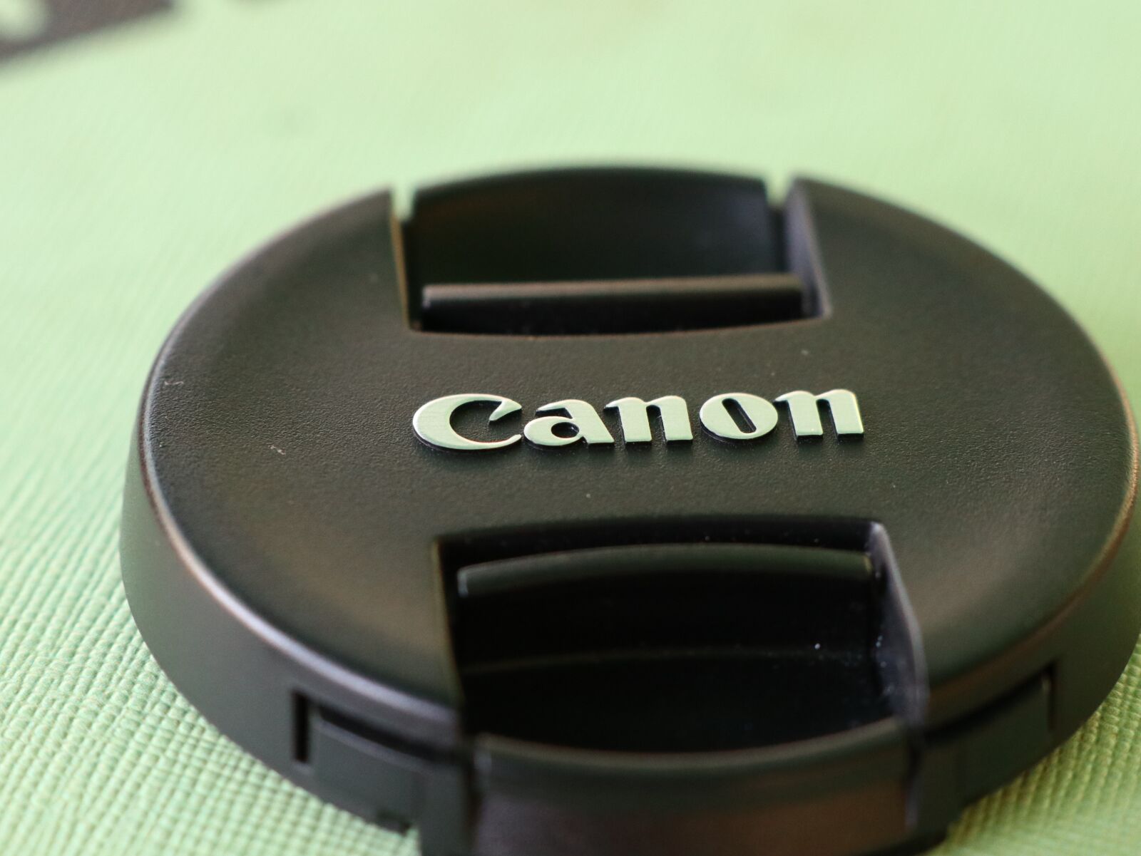Canon EOS M6 sample photo. Black canon cover, round photography